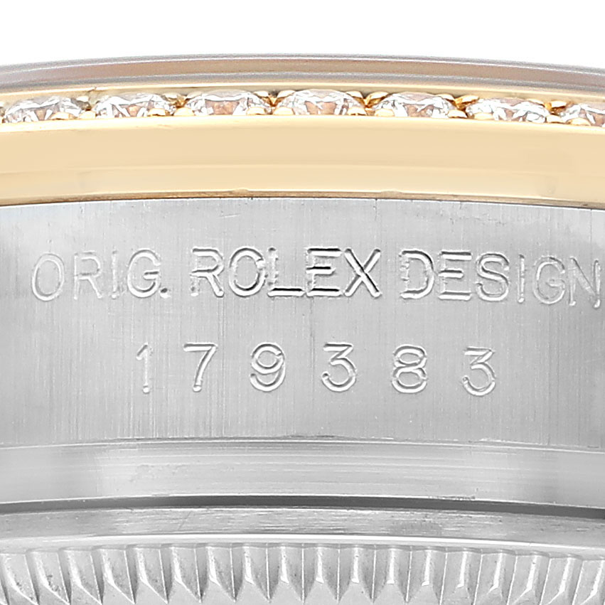 The image shows a close-up of the Rolex Datejust 179383 Women's Steel and Gold (two tone) Silver Dial watch's case side with the model number and a diamond-set bezel.