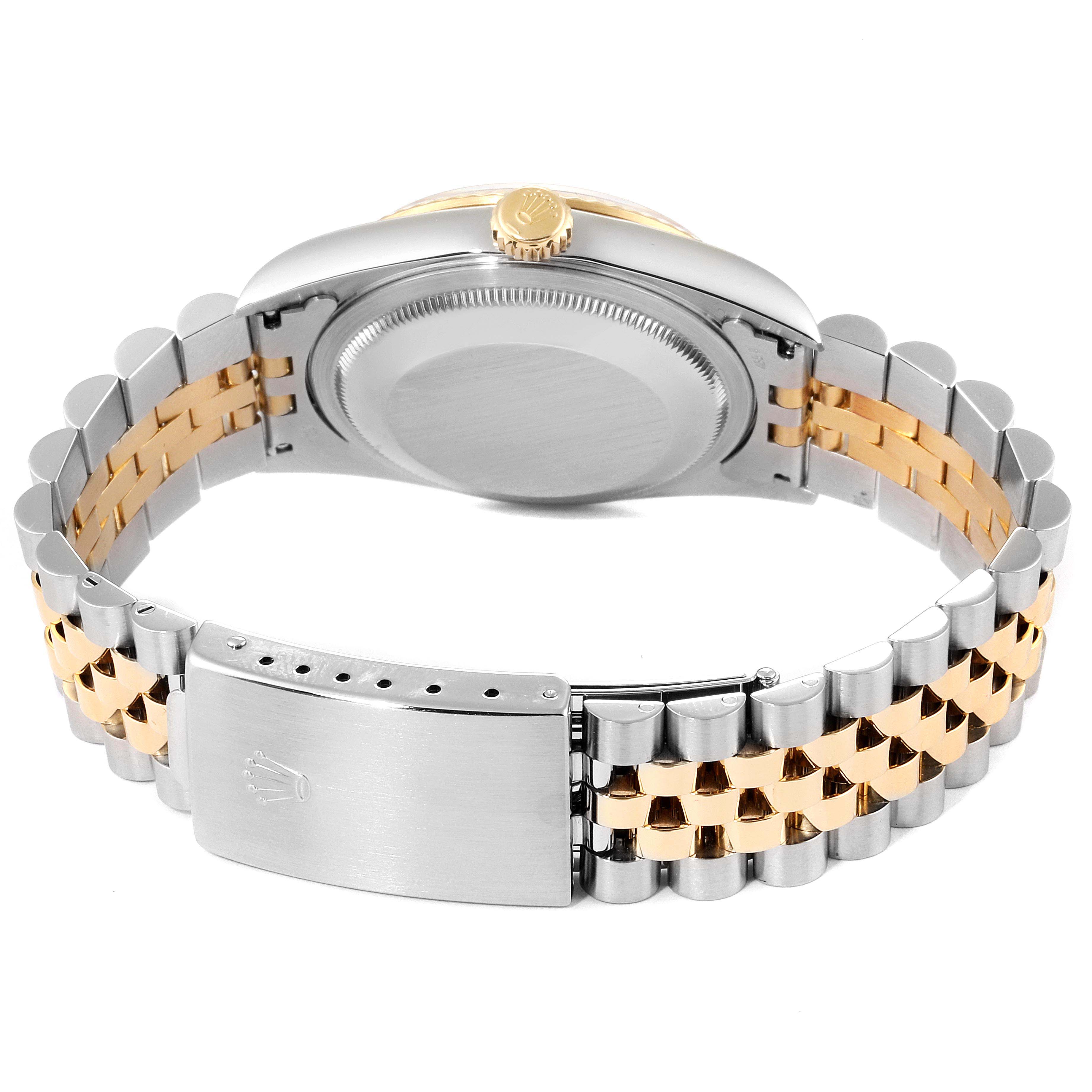 The image shows the back case, crown, and bracelet of a Rolex Datejust 16233 Men's Steel and Gold (two tone) White Dial 16233 Men's Steel and Gold (two tone) White Dial watch from a bottom view.