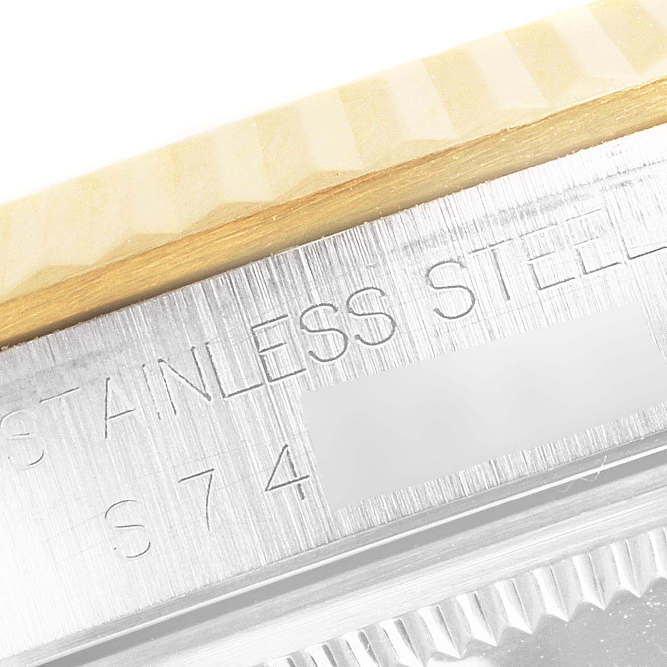 This image shows a macro angle of the Rolex Datejust 16233 Men's Steel and Gold (two tone) White Dial 16233 Men's Steel and Gold (two tone) White Dial's bezel and part of the casing, with "Stainless Steel" engraving visible.