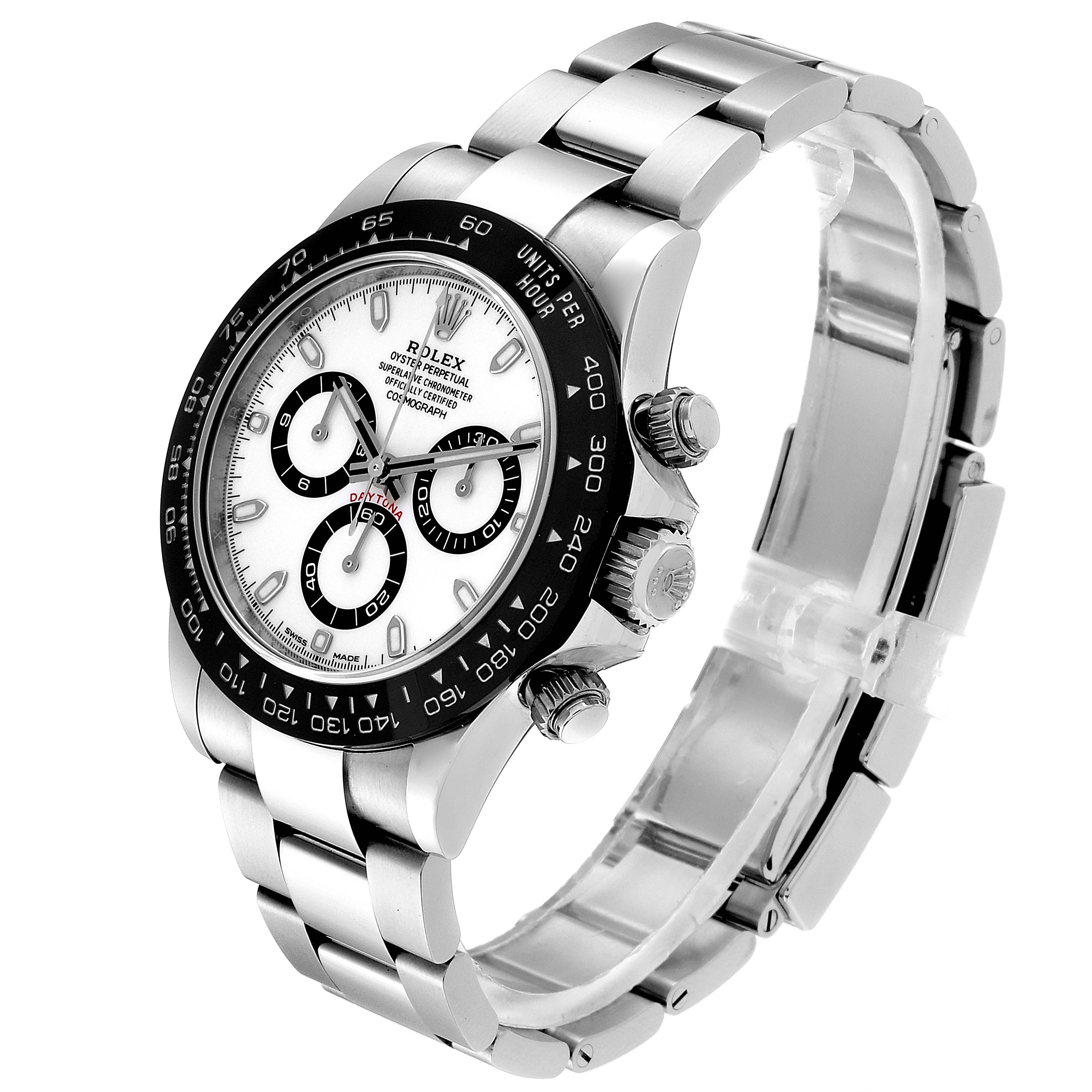 This image shows a Rolex Daytona 116500 Men's Stainless Steel White Dial 116500 Men's Stainless Steel White Dial watch at an angle displaying the face, bezel, crown, pushers, and bracelet.