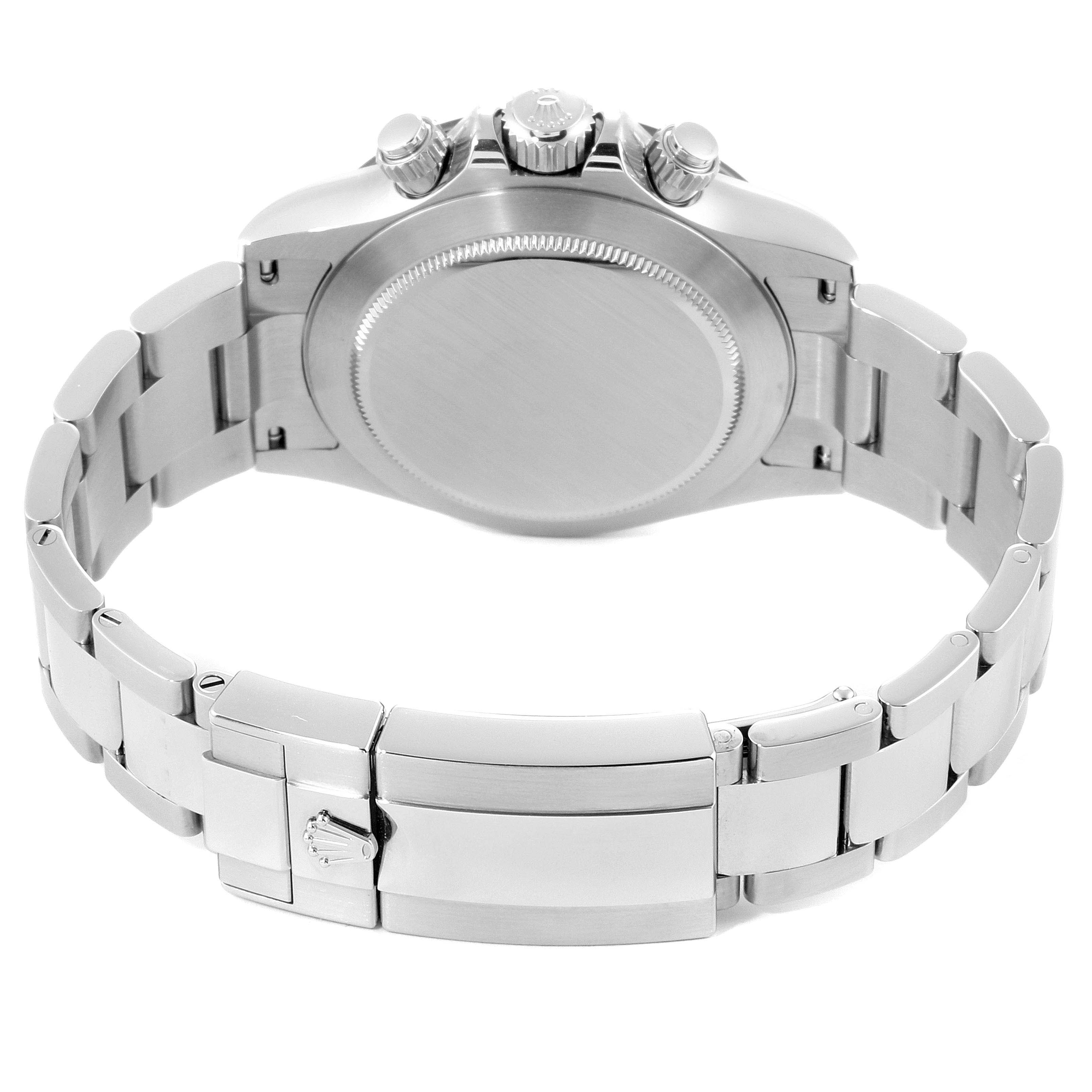 This image shows the back case and part of the bracelet of a Rolex Daytona 116500 Men's Stainless Steel White Dial 116500 Men's Stainless Steel White Dial watch at a slight angle.