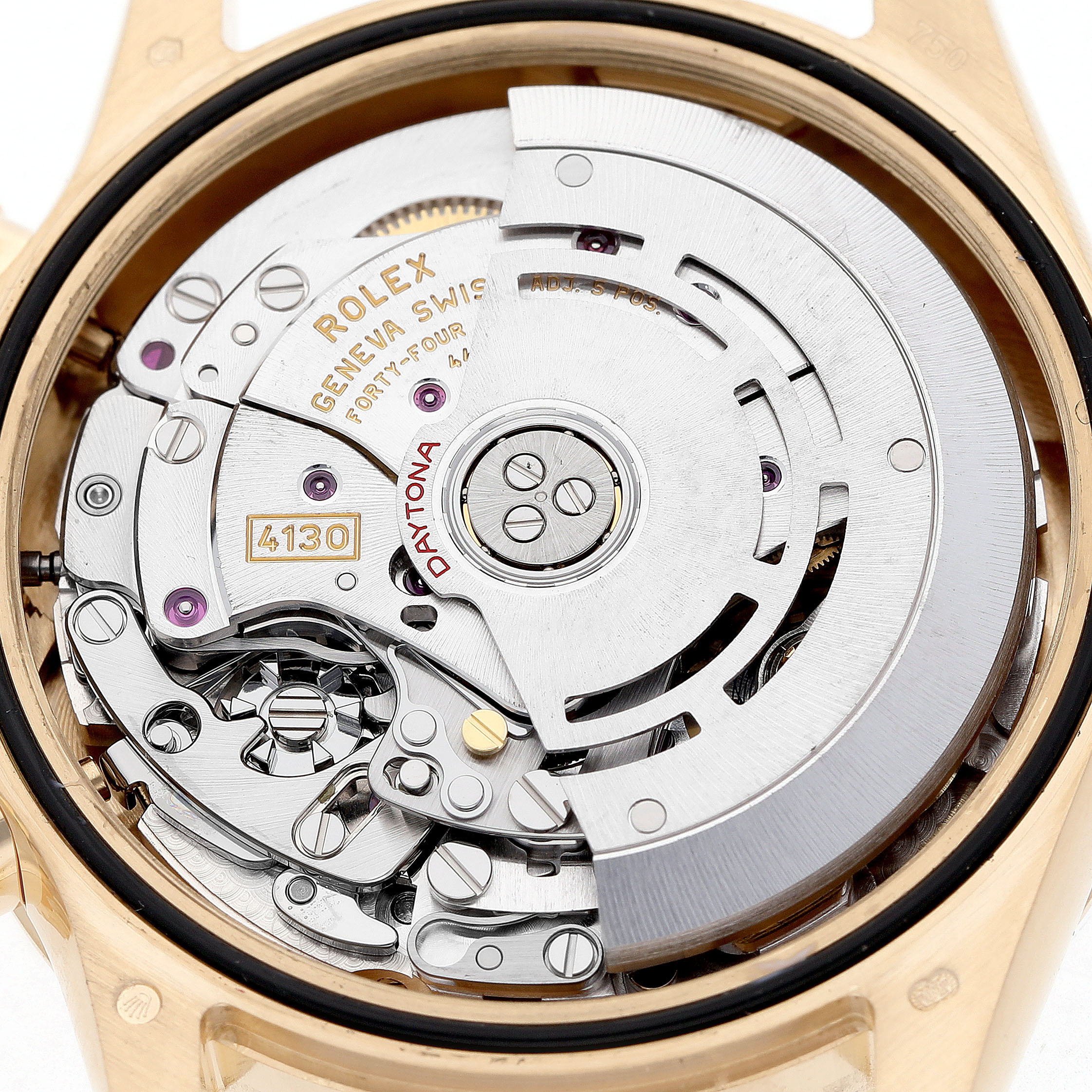 The image shows the movement of a Rolex Daytona 116508 Men's Yellow Gold Black Dial watch, focusing on the intricate internal mechanics.