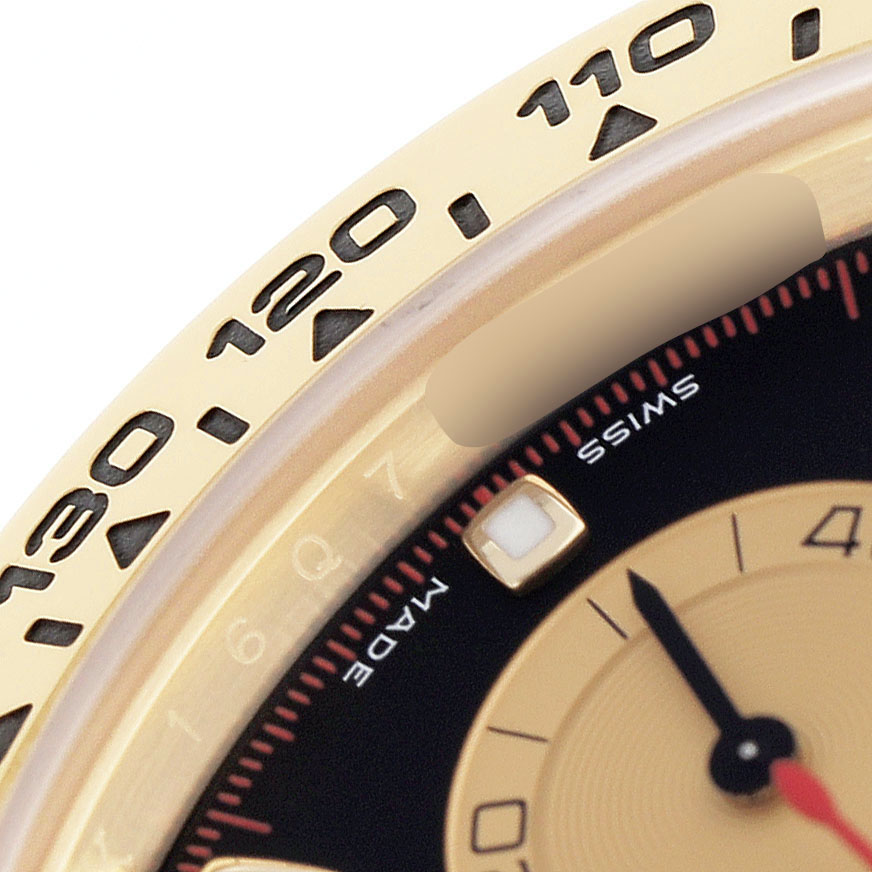 The image shows a close-up of the bezel and part of the dial of a Rolex Daytona 116508 Men's Yellow Gold Black Dial watch, displaying minute markers and hour indicators.