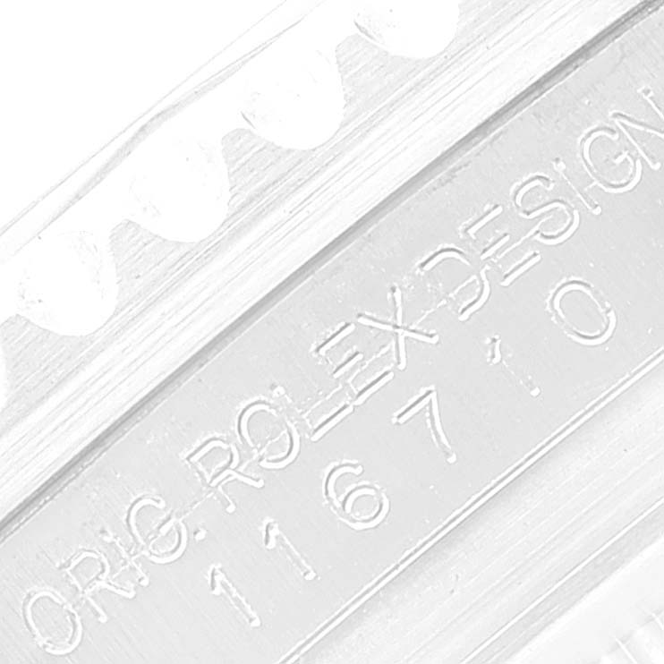 This is a close-up of the Rolex GMT-Master 116710 Men's Stainless Steel Black Dial 116710 Men's Stainless Steel Black Dial's case showing the engraved "ORIG ROLEX DESIGN" and model number.