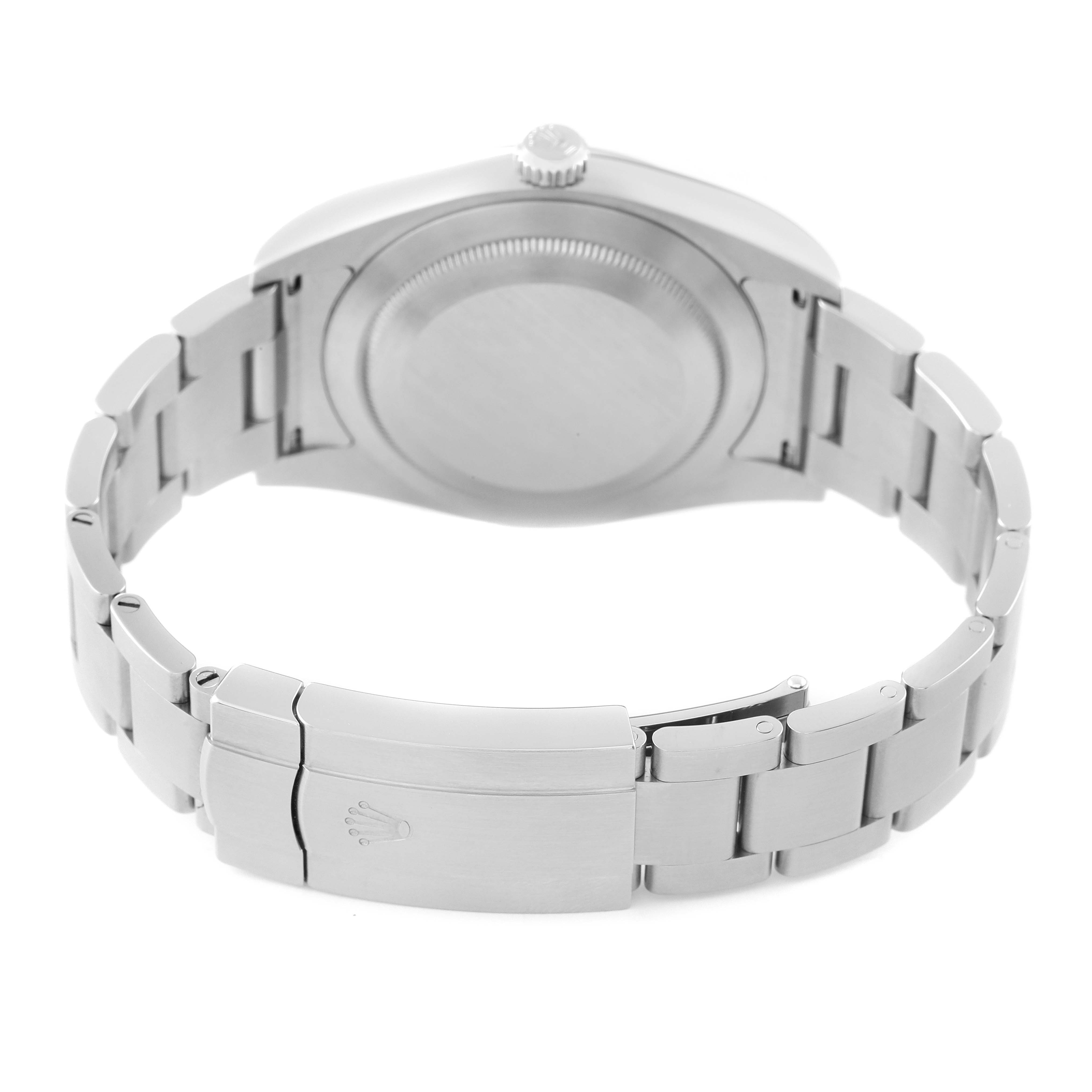 The image shows the Rolex Oyster Perpetual 114300 Men's Stainless Steel Grey Dial 114300 Men's Stainless Steel Grey Dial watch from the rear, displaying the closed clasp and part of the bracelet.