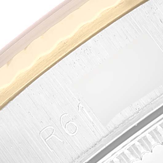 This image shows a close-up of the side of the bezel and case back of a Rolex Oyster Perpetual 67193 Women's Steel and Gold (two tone) Champagne Dial 67193 Women's Steel and Gold (two tone) Champagne Dial watch.