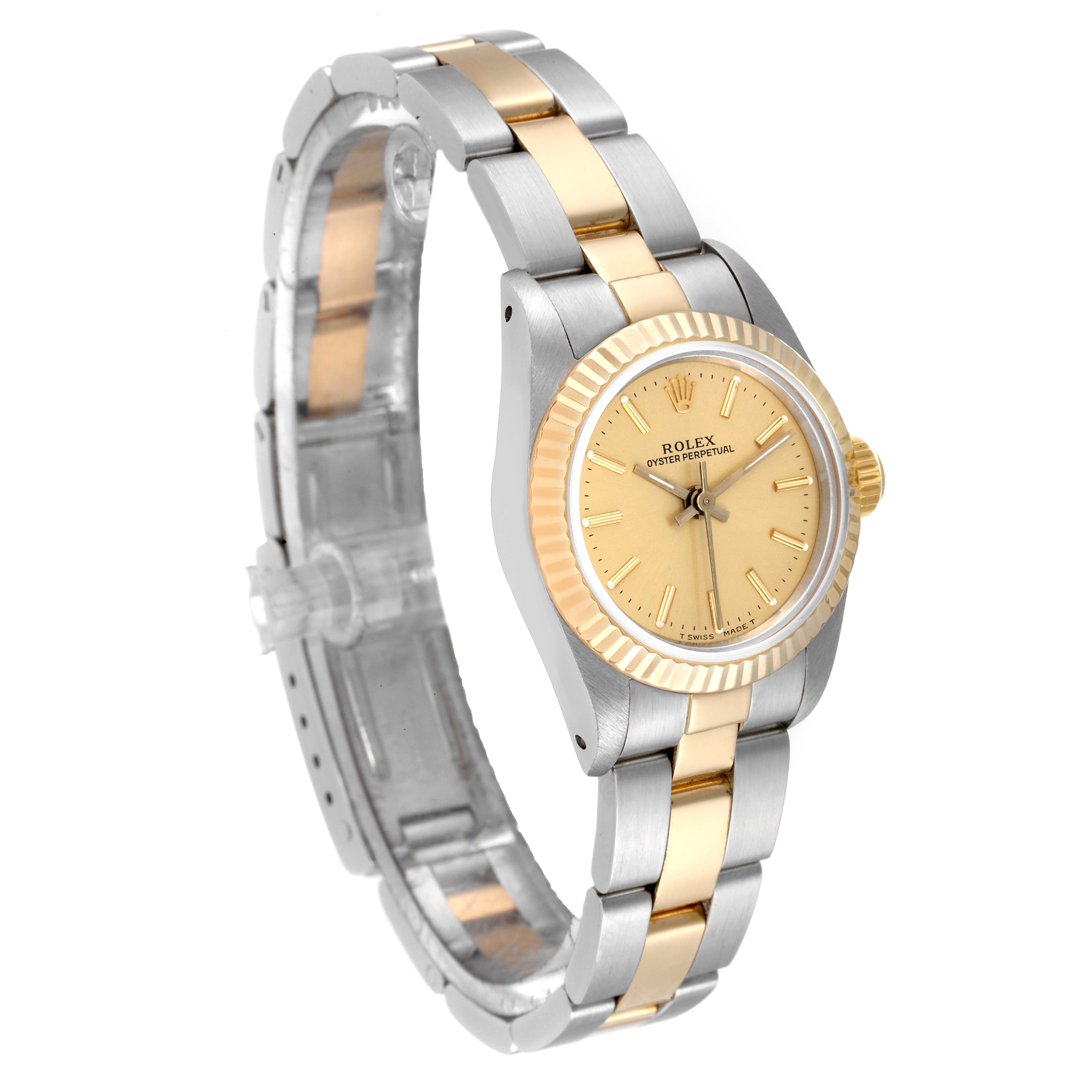 The image shows a side angle of an Oyster Perpetual Rolex watch, highlighting the gold and silver bracelet and the gold bezel.