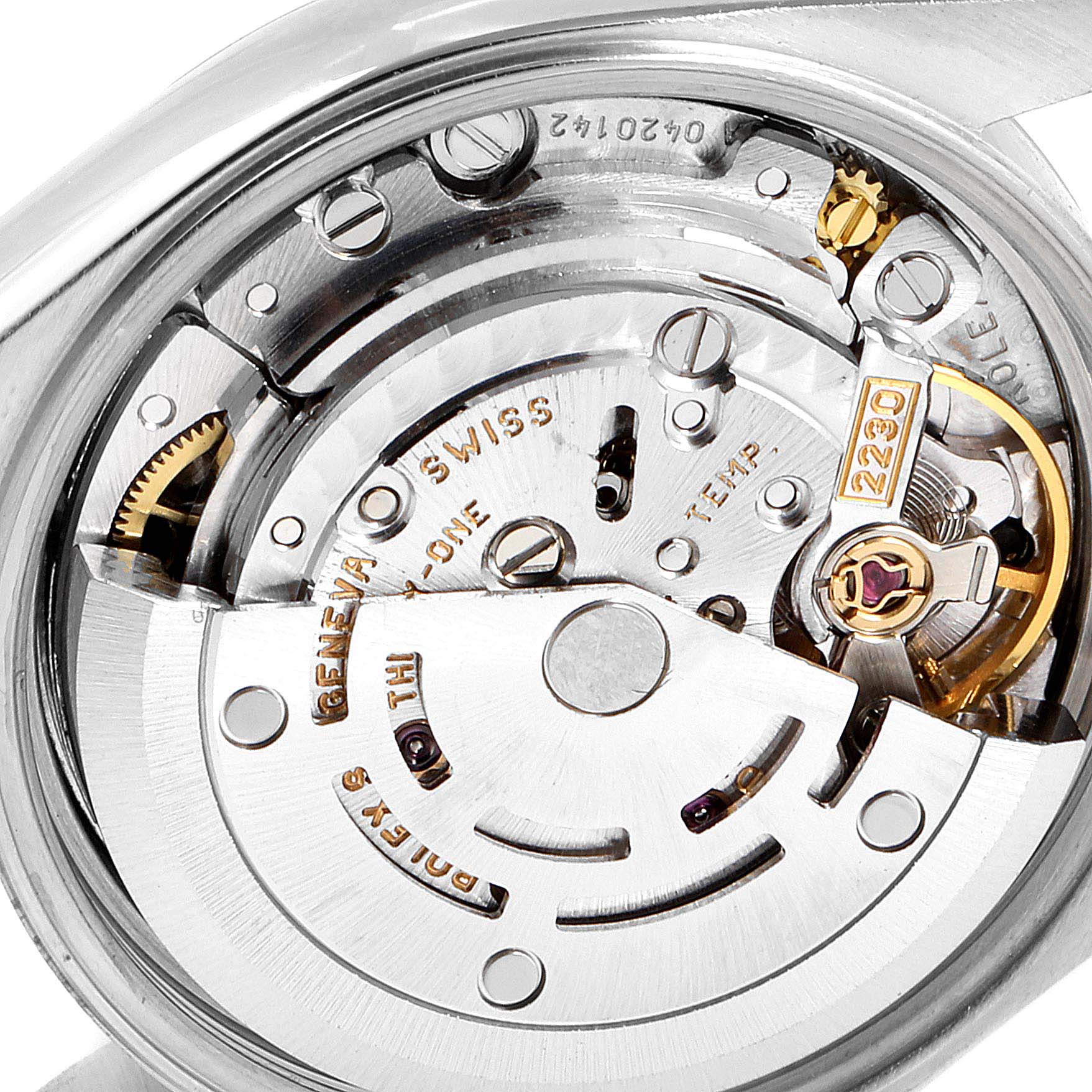 This image shows a close-up of the movement mechanism of a Rolex Oyster Perpetual 76080 Women's Stainless Steel Black Dial 76080 Women's Stainless Steel Black Dial watch.