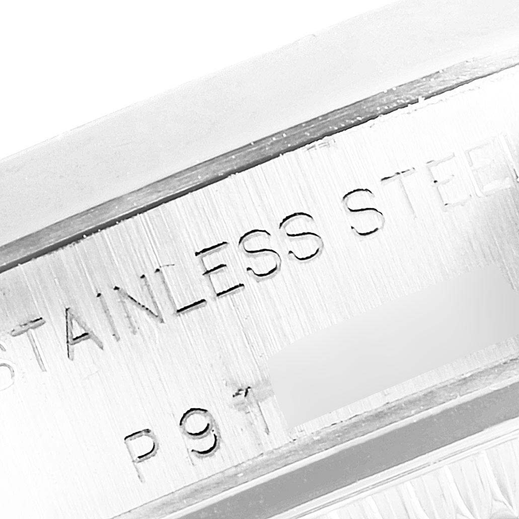 The close-up image shows the stainless steel inscription on the case of a Rolex Oyster Perpetual 76080 Women's Stainless Steel Black Dial 76080 Women's Stainless Steel Black Dial watch.
