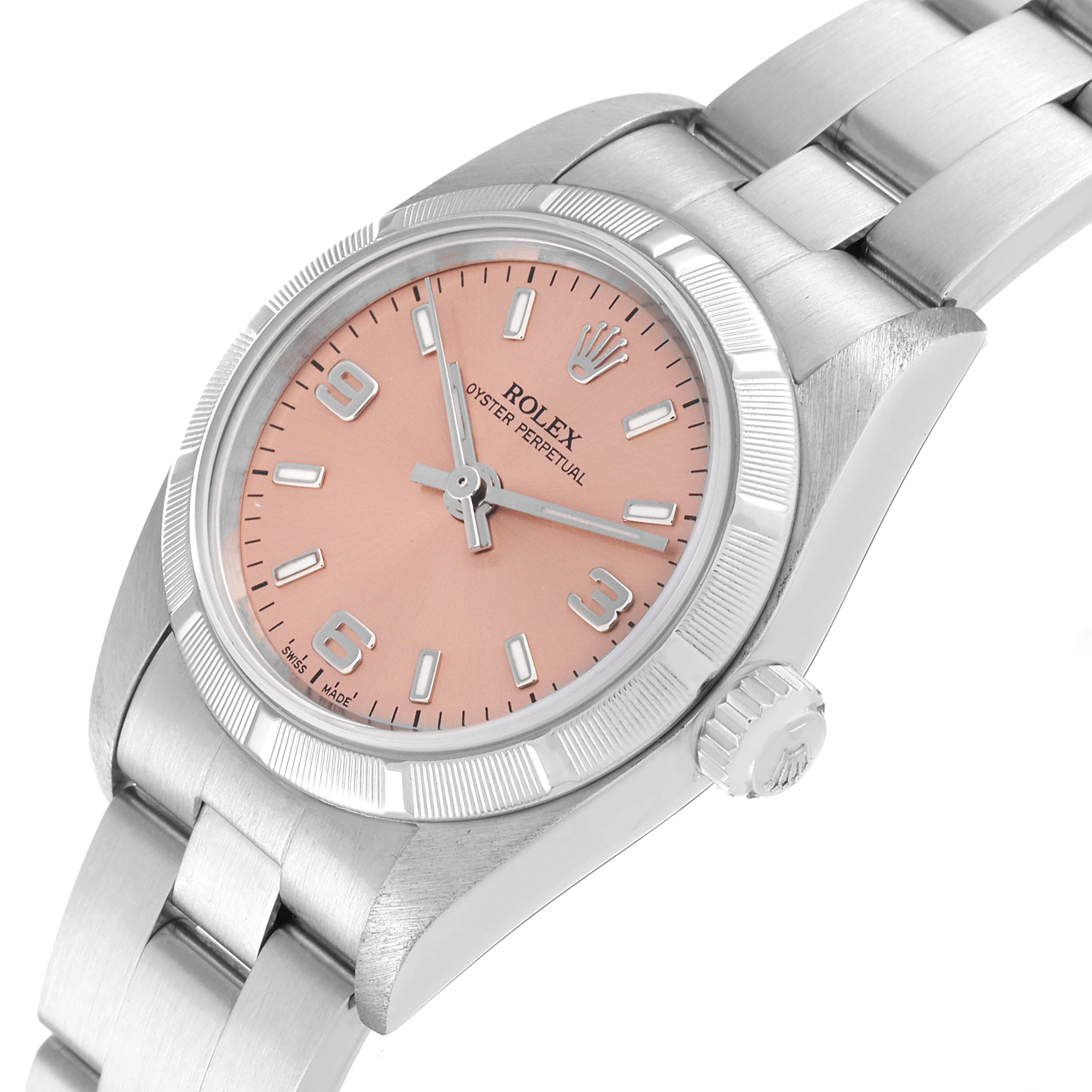 The Rolex Oyster Perpetual 76030 Women
s Stainless Steel Pink Dial 76030 Women
s Stainless Steel Pink Dial watch is shown at an angle that highlights the dial, bezel, crown, and part of the bracelet.