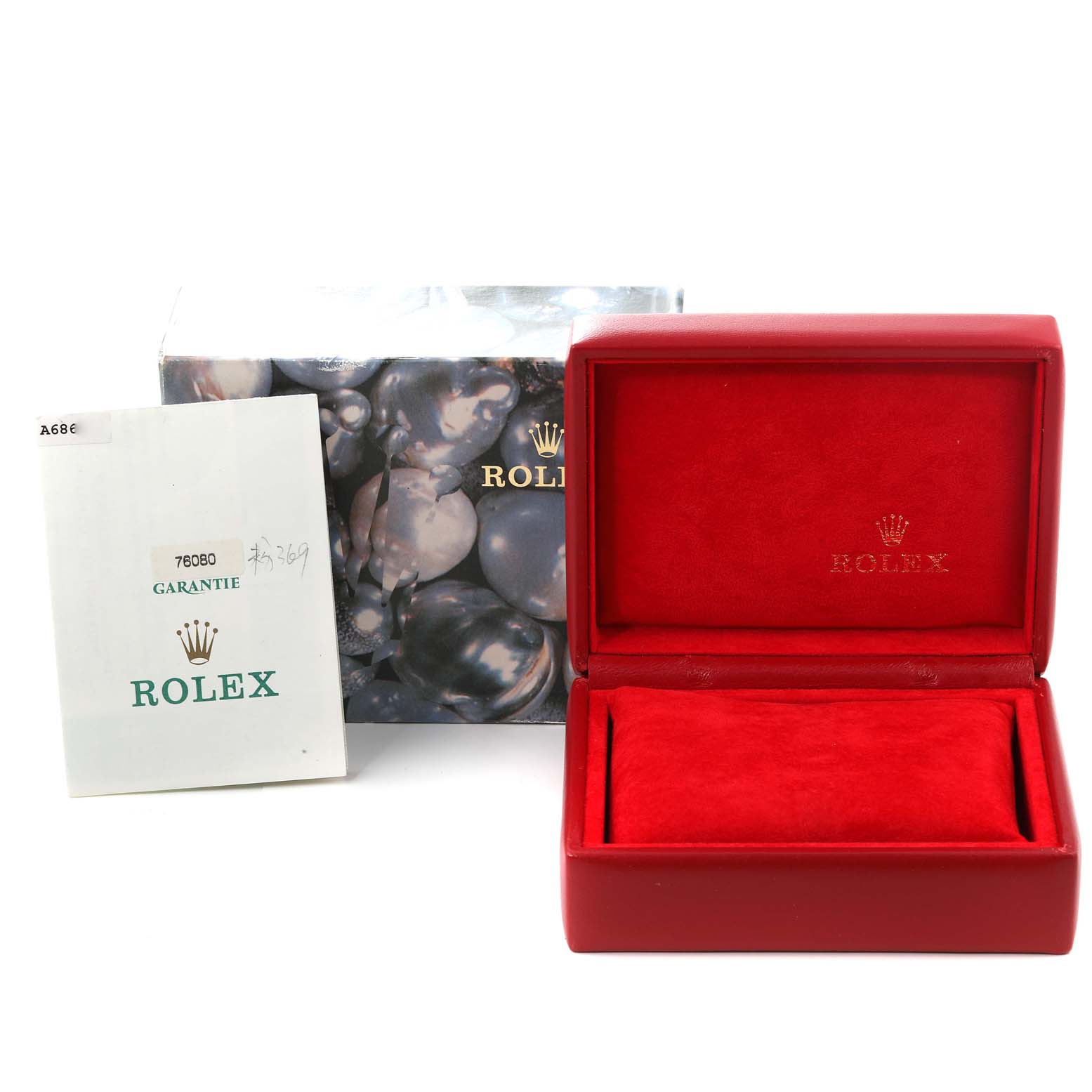 This image shows an open red Rolex watch box, a Rolex Oyster Perpetual 76080 Women
s Stainless Steel Pink Dial 76080 Women
s Stainless Steel Pink Dial model manual, and the original outer packaging box.