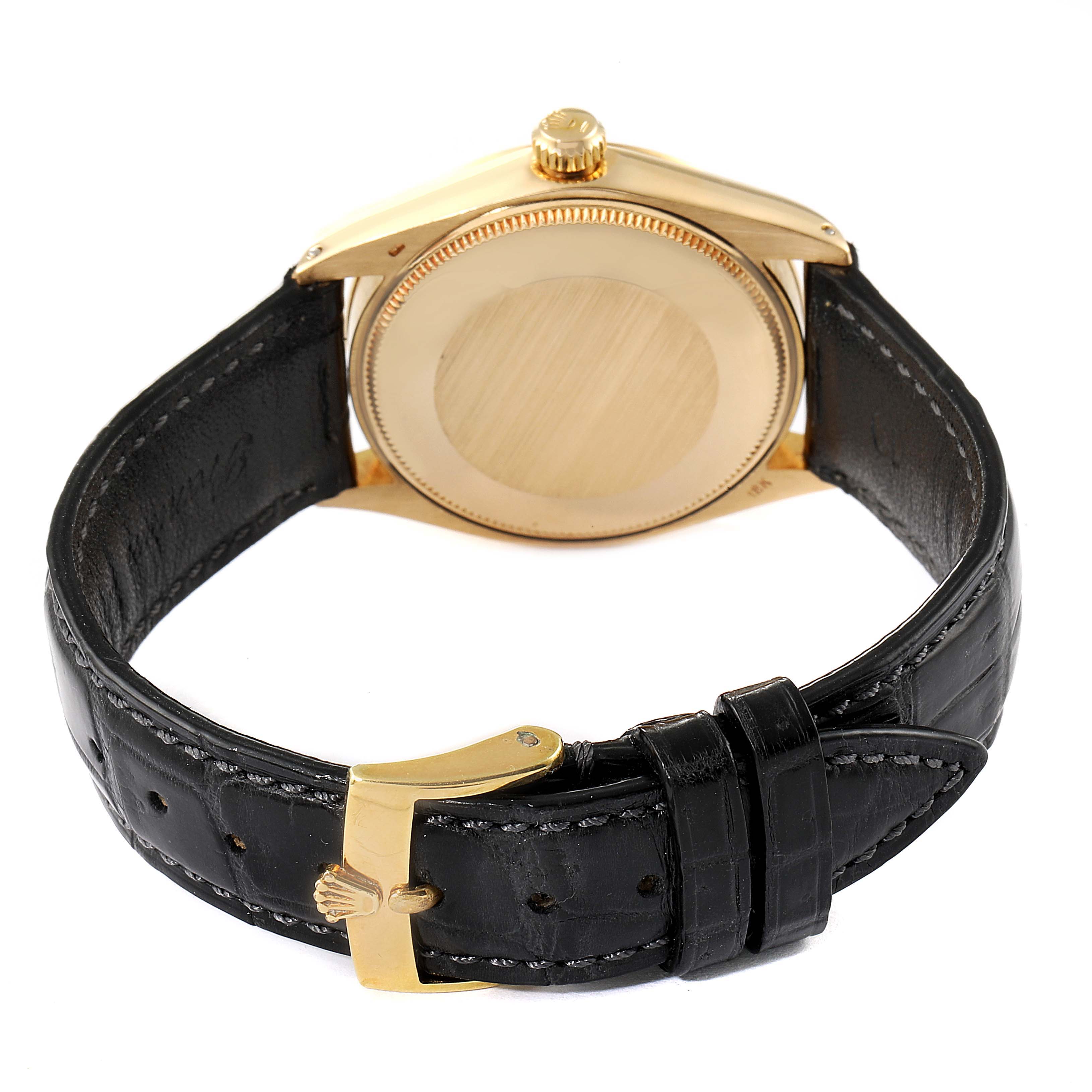 This image shows the back casing and leather strap of a Rolex Vintage Collection 1002 Men's Yellow Gold Grey Dial 1002 Men's Yellow Gold Grey Dial watch at a rear angle.