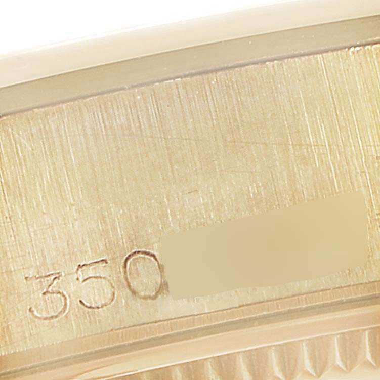 This image shows a close-up of the side casing with the serial number of a Rolex Vintage Collection 1002 Men's Yellow Gold Grey Dial 1002 Men's Yellow Gold Grey Dial model.