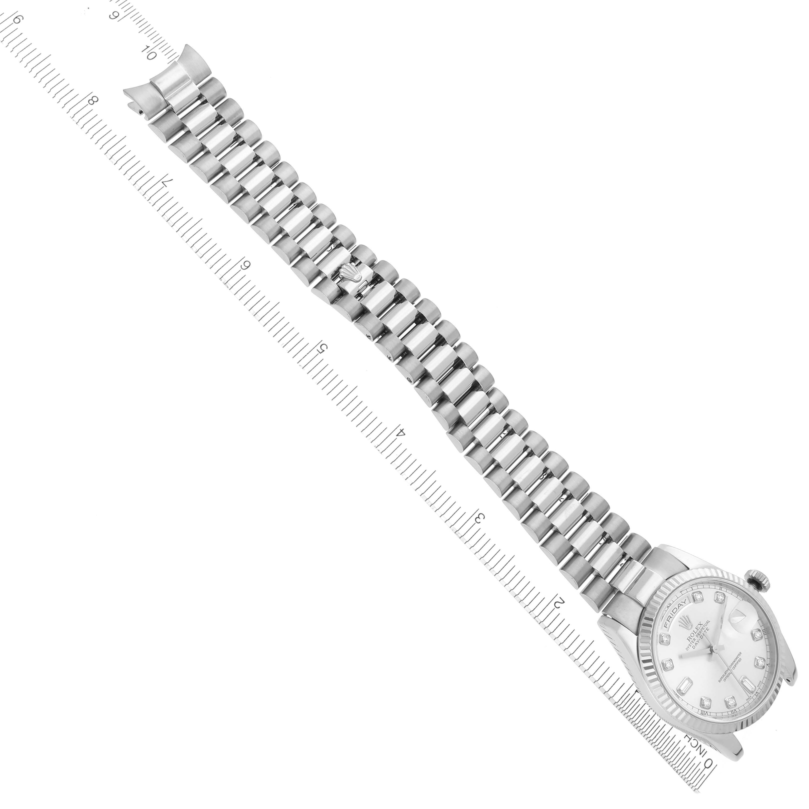 The image shows a Rolex President 118239A Men's White Gold Silver Dial 118239A Men's White Gold Silver Dial watch in a flat, overhead angle, displaying the band and face alongside a ruler.