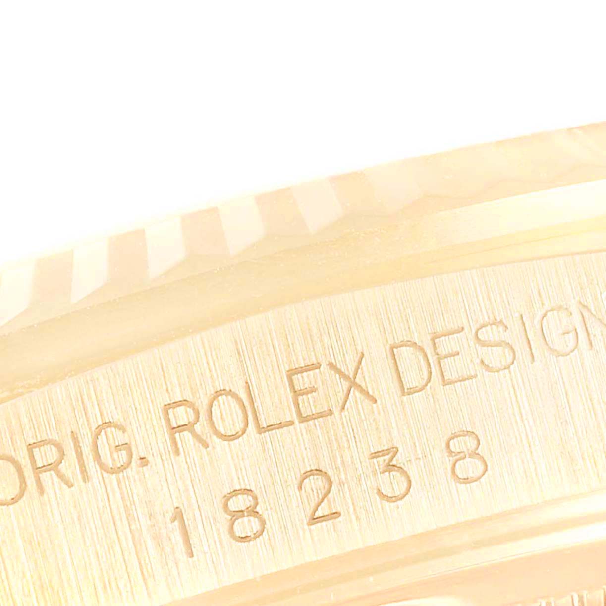 This close-up image shows the engraved side details of the Rolex President 18238 Men
s Yellow Gold Champagne Dial 18238 Men
s Yellow Gold Champagne Dial model watch, highlighting its serial number.