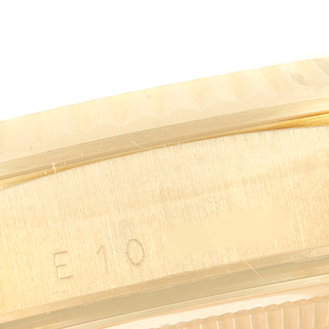 This is a close-up angle showing the side engraving on the bezel of the Rolex President 18238 Men
s Yellow Gold Champagne Dial 18238 Men
s Yellow Gold Champagne Dial model watch.