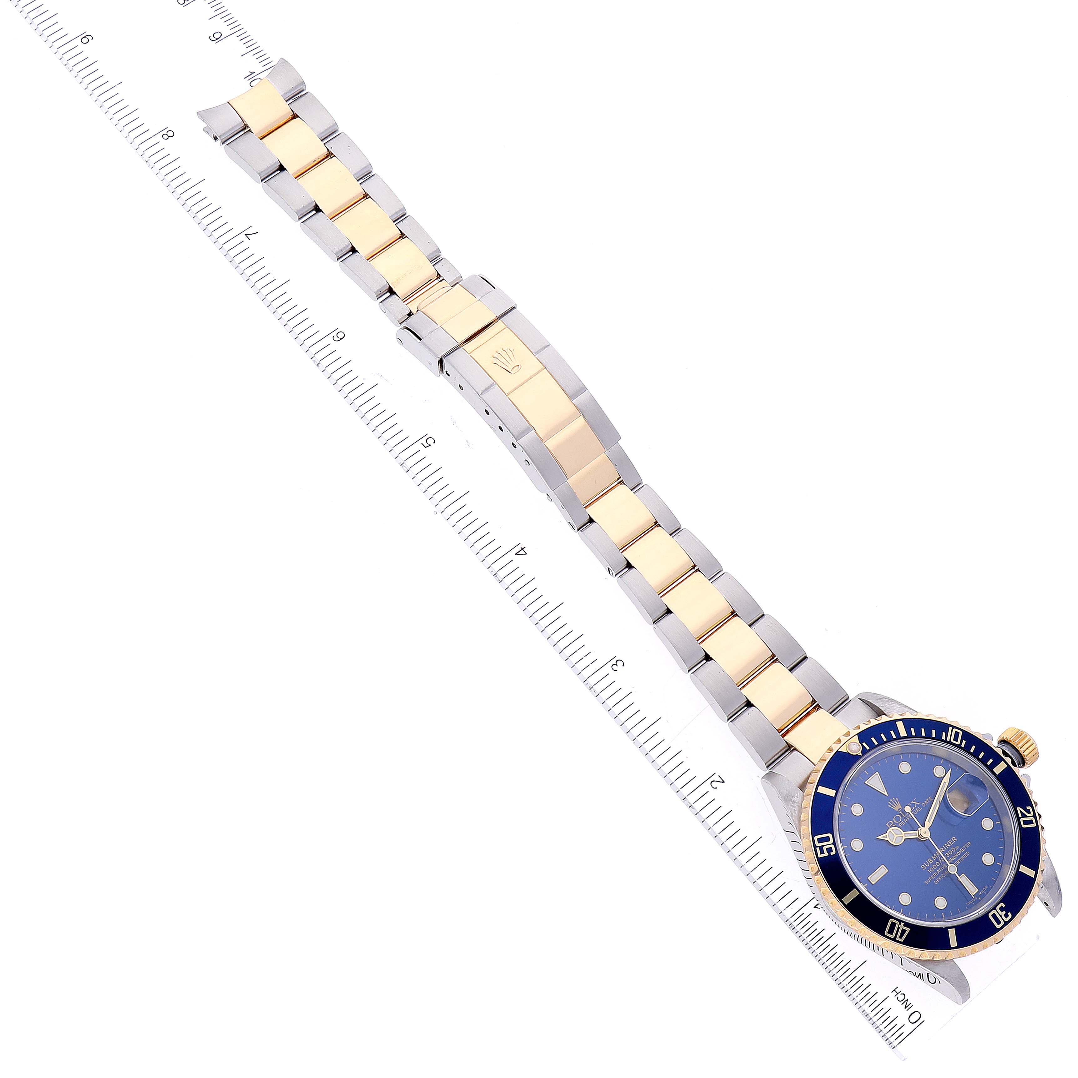 The image shows a Rolex Submariner 16613 Men
s Steel and Gold (two tone) Blue Dial 16613 Men
s Steel and Gold (two tone) Blue Dial watch laid flat with its dial, bezel, bracelet, and clasp visible.
