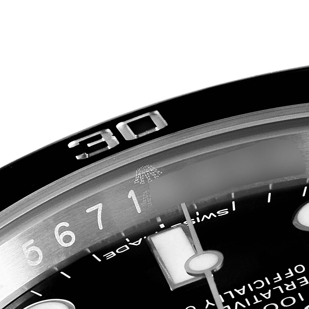 This close-up image of the Rolex Submariner 116610 Men's Stainless Steel Black Dial 116610 Men's Stainless Steel Black Dial watch shows the bezel with the 30-minute mark and part of the dial and hour markers.