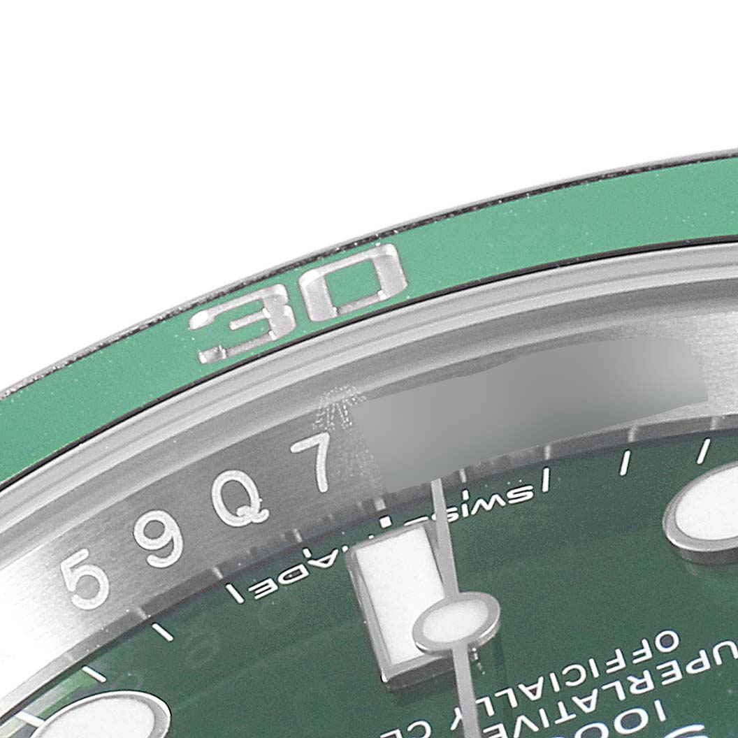 The image shows a close-up of the bezel and dial of a Rolex Submariner 116610LV Men's Stainless Steel Green Dial 116610LV Men's Stainless Steel Green Dial watch, highlighting the 30-minute mark and part of the green face.
