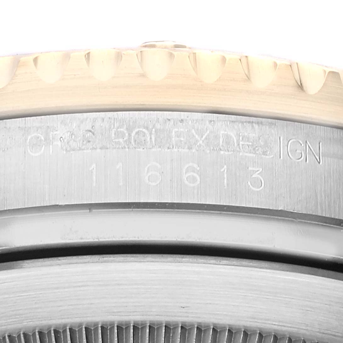 This image shows a close-up of the side of a Rolex Submariner 116613 Men's Steel and Gold (two tone) Black Dial 116613 Men's Steel and Gold (two tone) Black Dial watch, highlighting part of the bezel and the engraved model number.