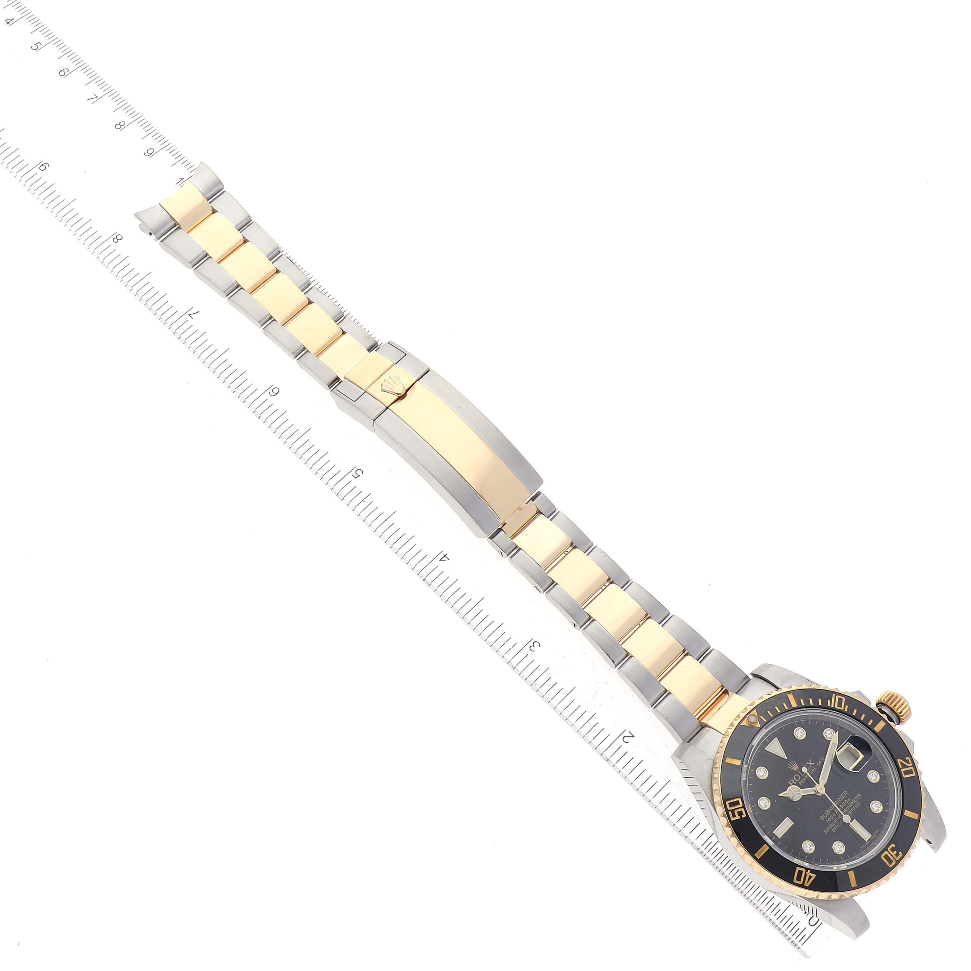 This image shows the full bracelet and face of a Rolex Submariner 116613 Men's Steel and Gold (two tone) Black Dial 116613 Men's Steel and Gold (two tone) Black Dial watch, viewed from above.