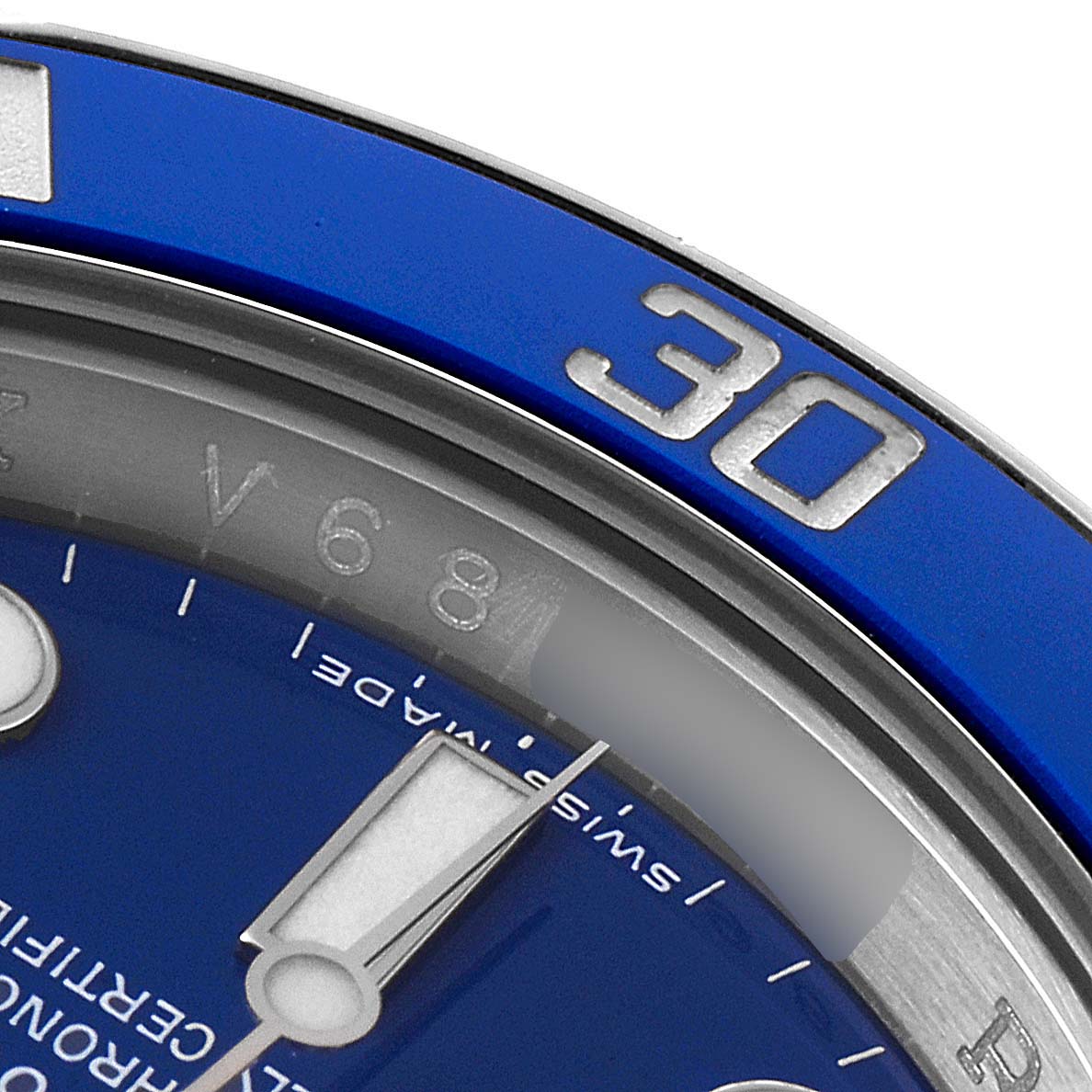 The image shows a close-up angle of the bezel and part of the dial of a Rolex Submariner 116619 Men's White Gold Blue Dial 116619 Men's White Gold Blue Dial watch.