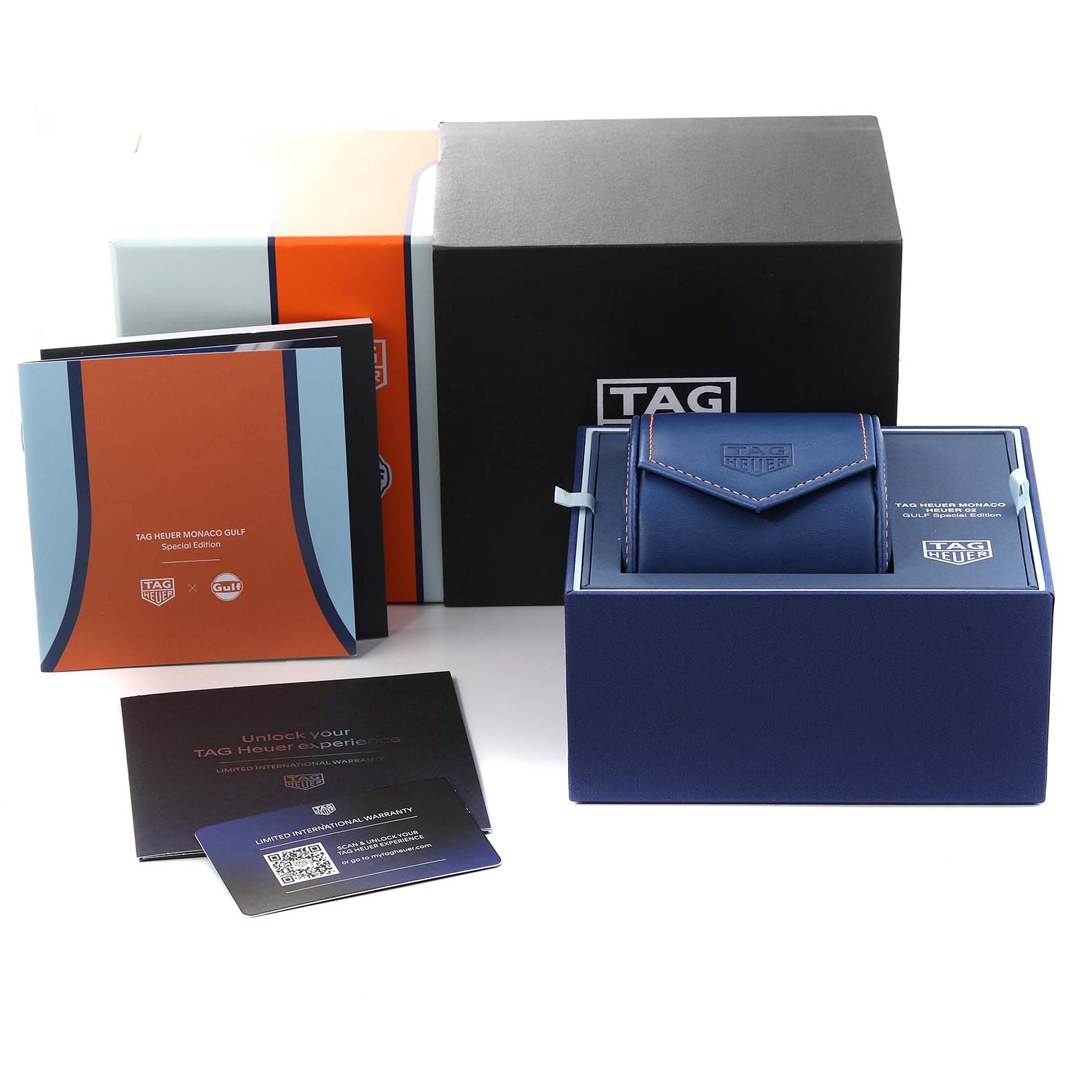 The image shows the box, manual, warranty card, and pouch of the Tag Heuer Monaco CBL2115.FC6494 Men's Stainless Steel Blue Dial CBL2115.FC6494 Men's Stainless Steel Blue Dial model watch from a top angle.