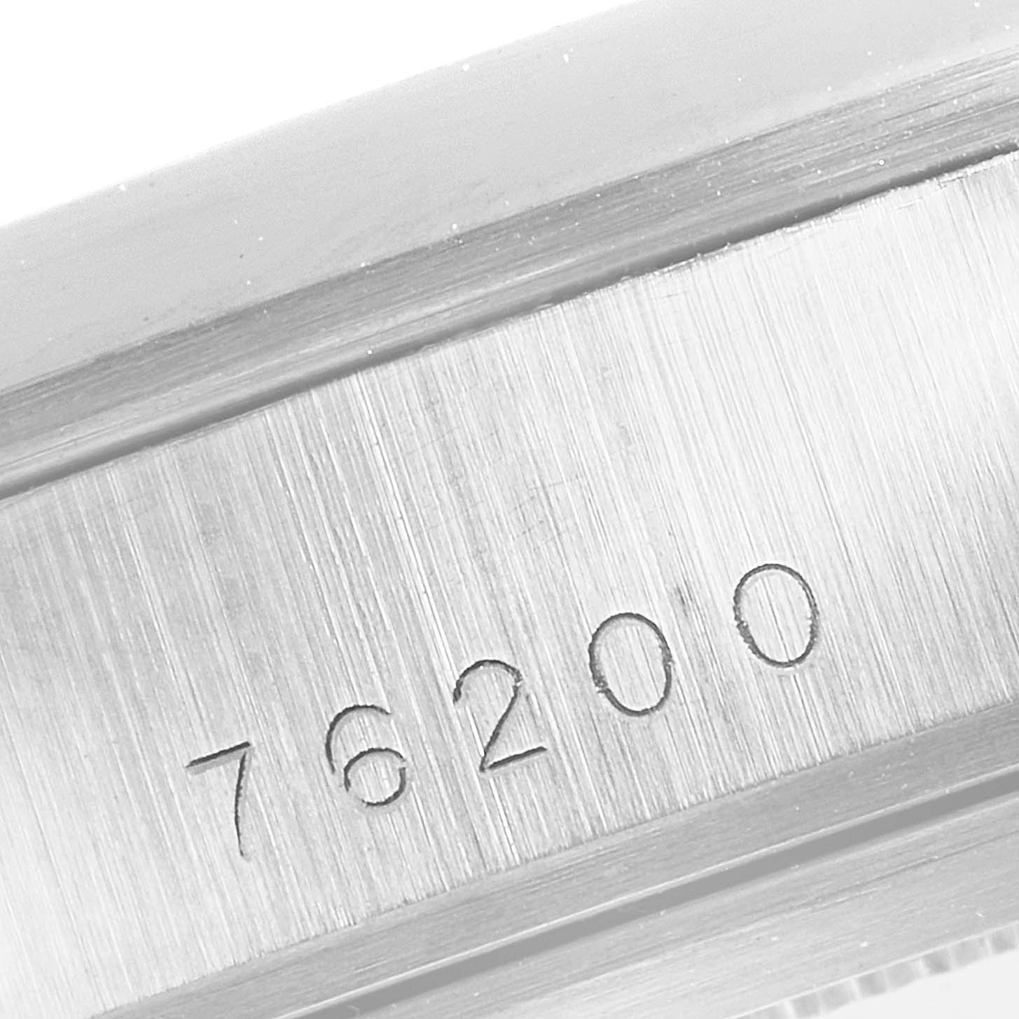 This close-up image shows the model number engraving on the case back of a Tudor Glamour 76200 Men's Stainless Steel Blue Dial 76200 Men's Stainless Steel Blue Dial watch.