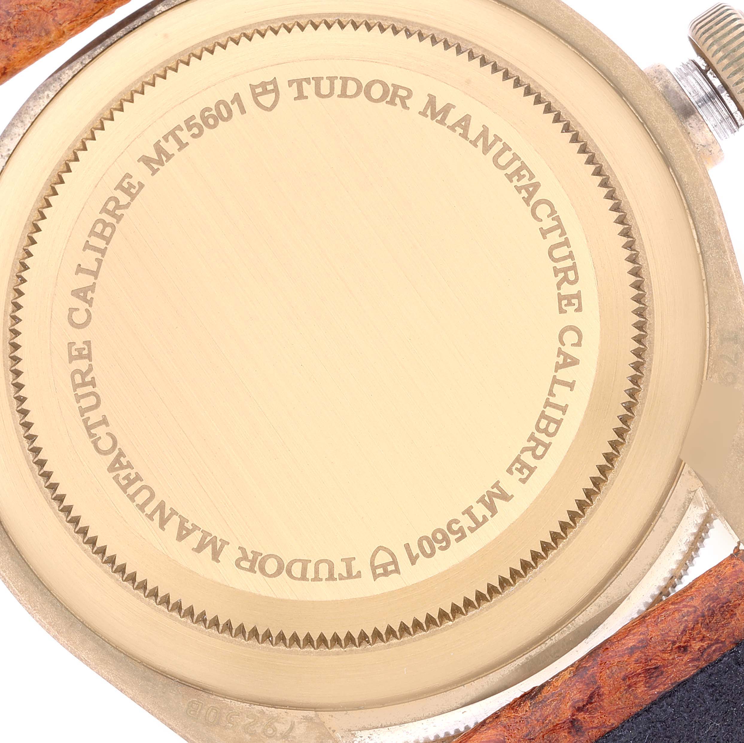 The image shows the case back of a Tudor Heritage Black Bay 79250B Men's Bronze Brown Dial 79250B Men's Bronze Brown Dial watch, displaying the Tudor branding and model number MT5601.