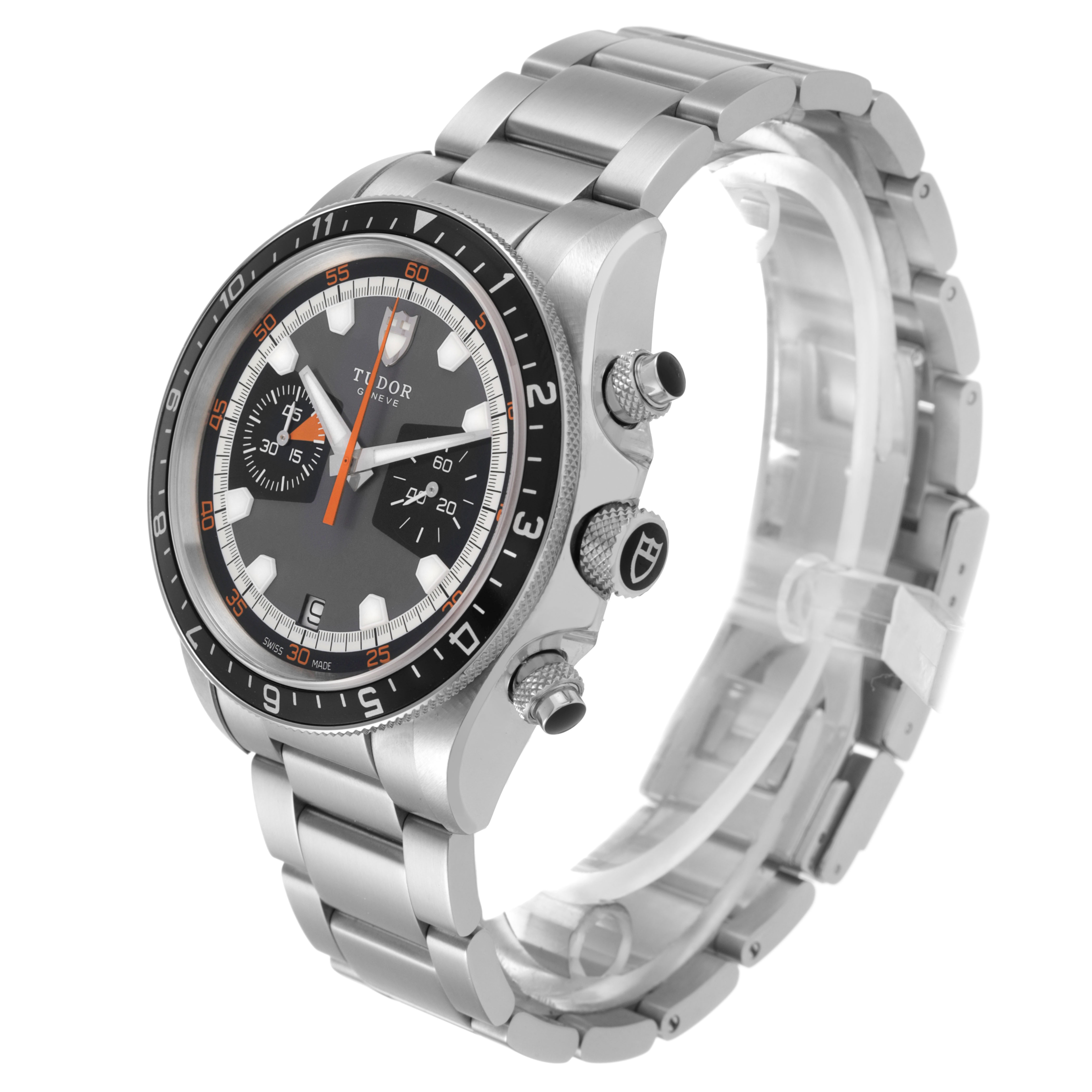 The Tudor Heritage Chrono 70330N-65740 Men's Stainless Steel Grey Dial watch is shown at a three-quarter angle, highlighting the face, bezel, buttons, and bracelet.