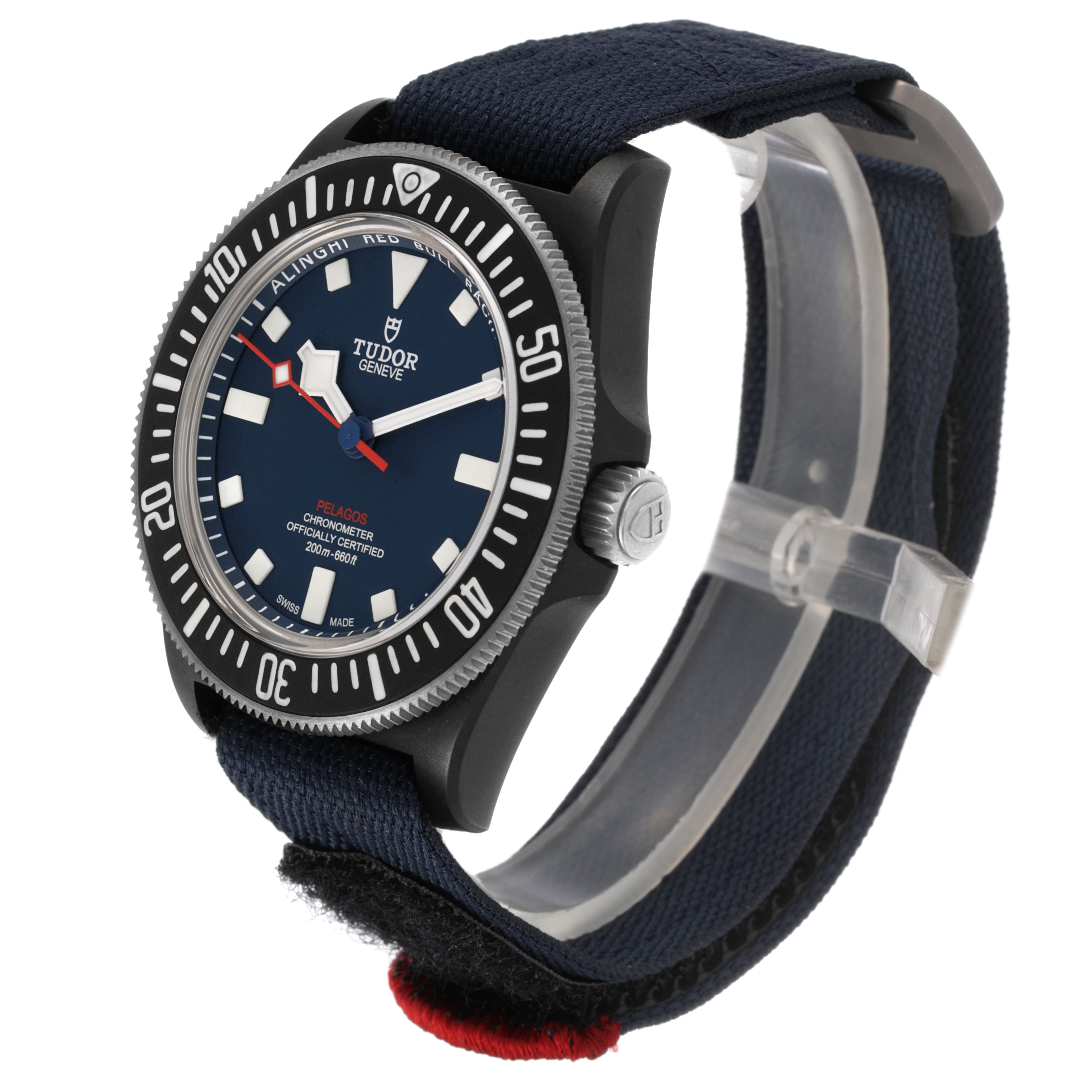 The Tudor Pelagos 25707KN Men's Titanium Blue Dial watch is shown from a three-quarter angle highlighting the dial, crown, and fabric strap.