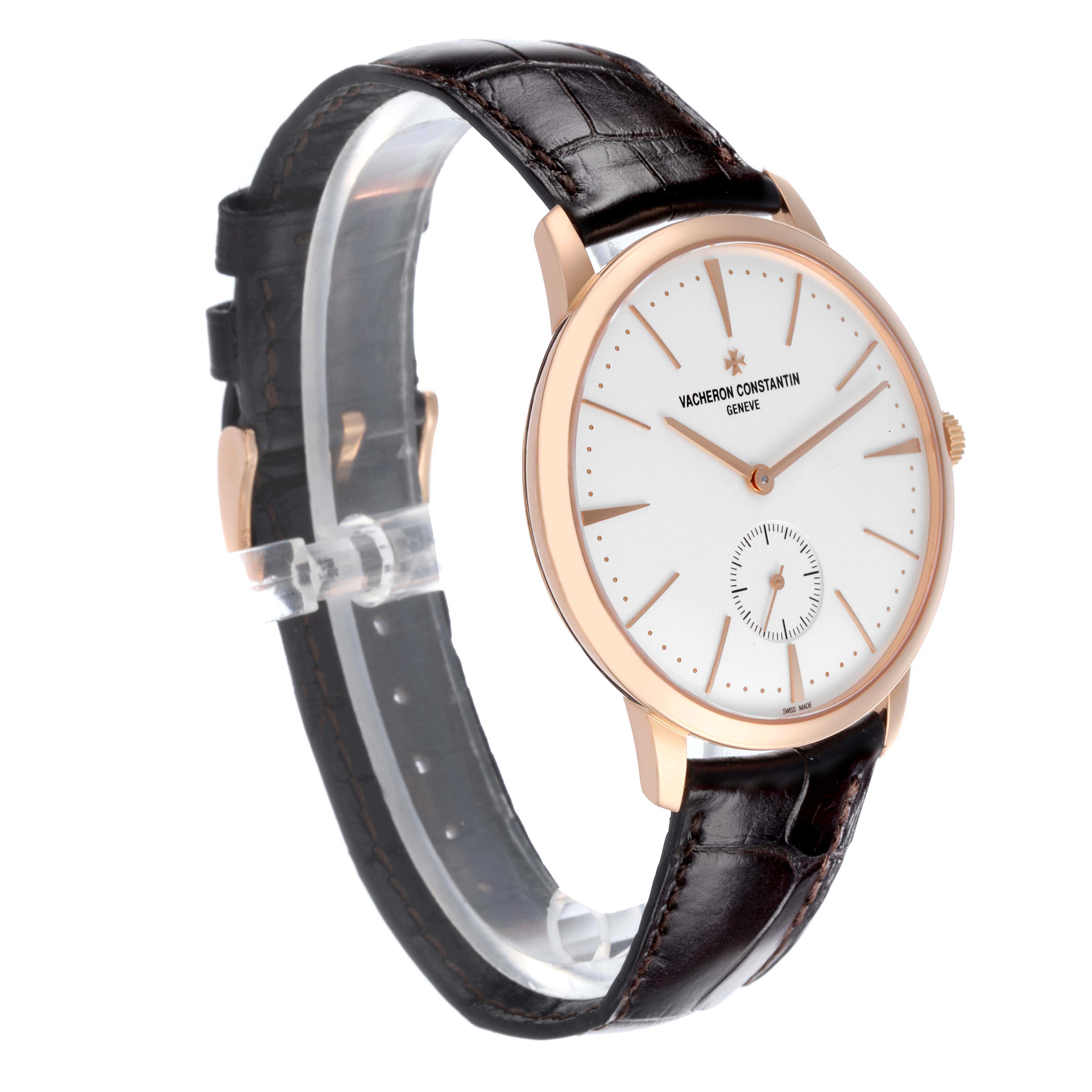 The Vacheron Constantin Patrimony 1110U/000R-B085 Men's Rose Gold Silver Dial 1110U/000R-B085 Men's Rose Gold Silver Dial watch is shown from a side angle, displaying its case, dial, and leather strap.