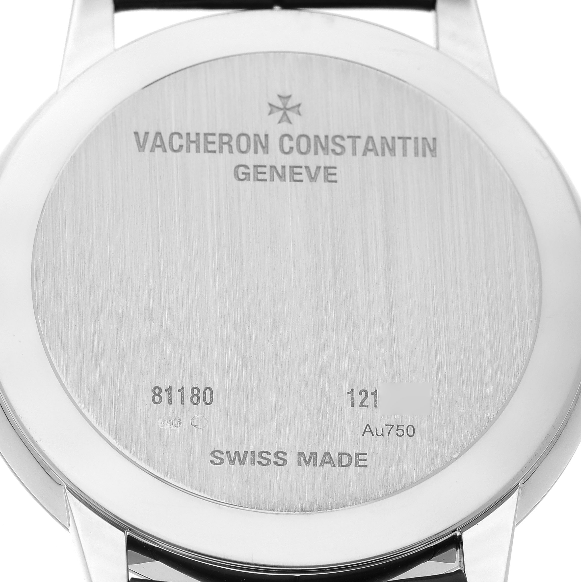 The image shows the back view of a Vacheron Constantin Patrimony 81180/000G-9117 Men's White Gold Silver Dial watch, highlighting the engraved details and metal texture.