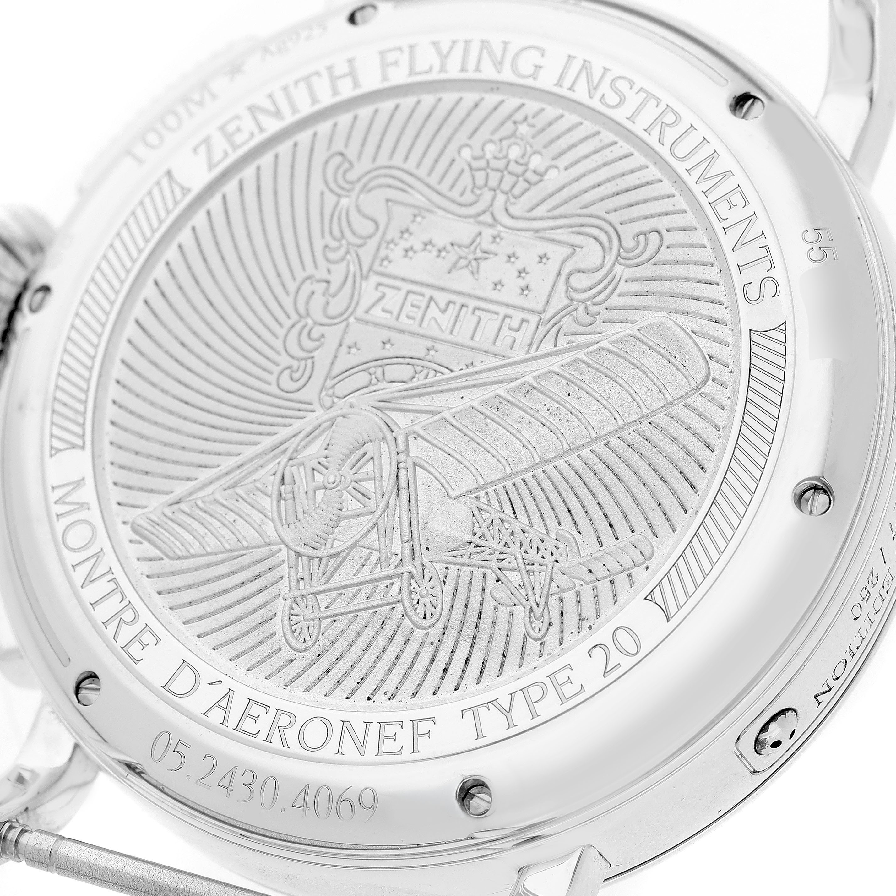 The image shows the back case of the Zenith Pilot 05.2430.4069/17.I011 Men's Titanium Silver Dial watch, featuring an engraved design.
