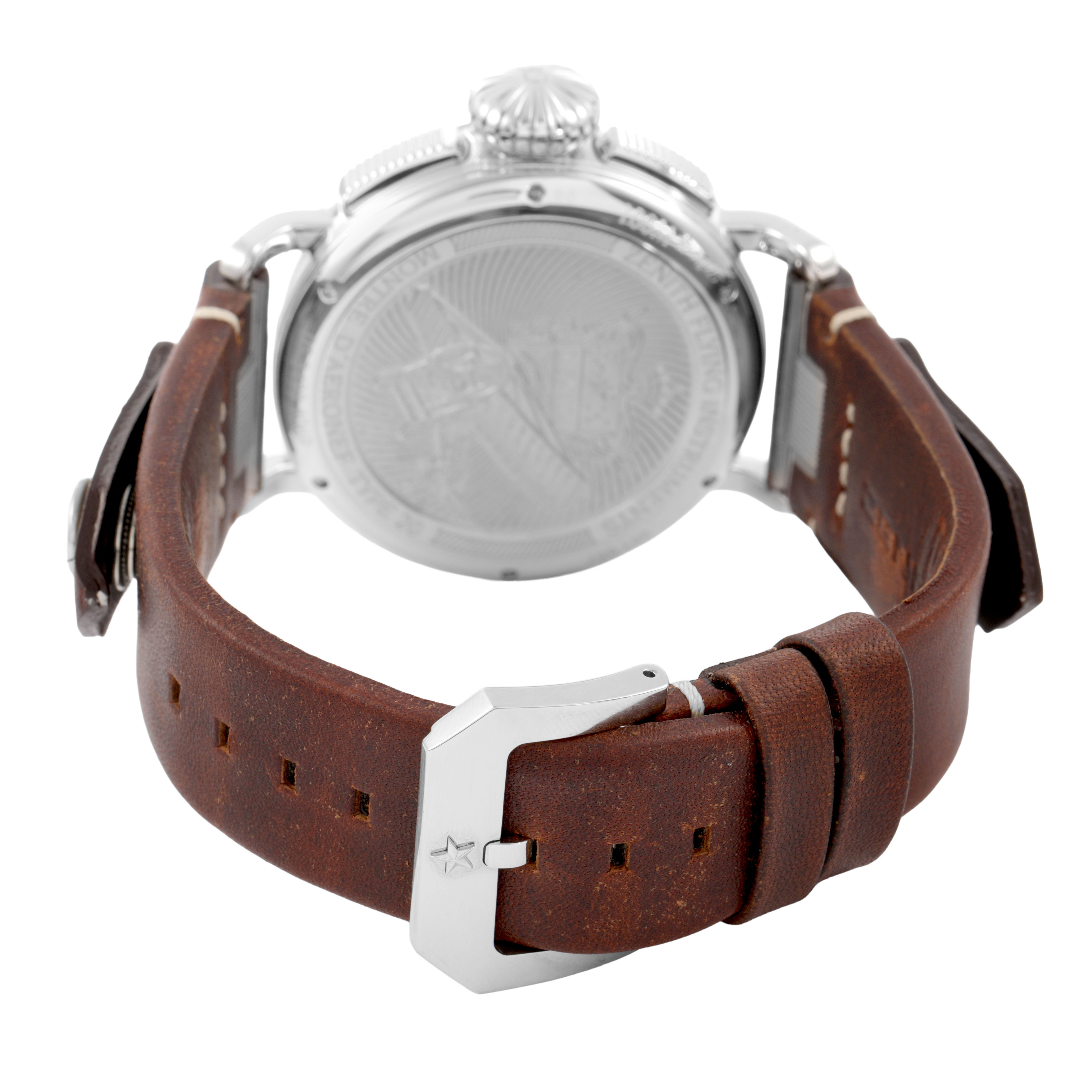 The image shows a Zenith Pilot 05.2430.4069/17.I011 Men's Titanium Silver Dial watch from the rear, highlighting the engraved case back and brown leather strap with a silver buckle.