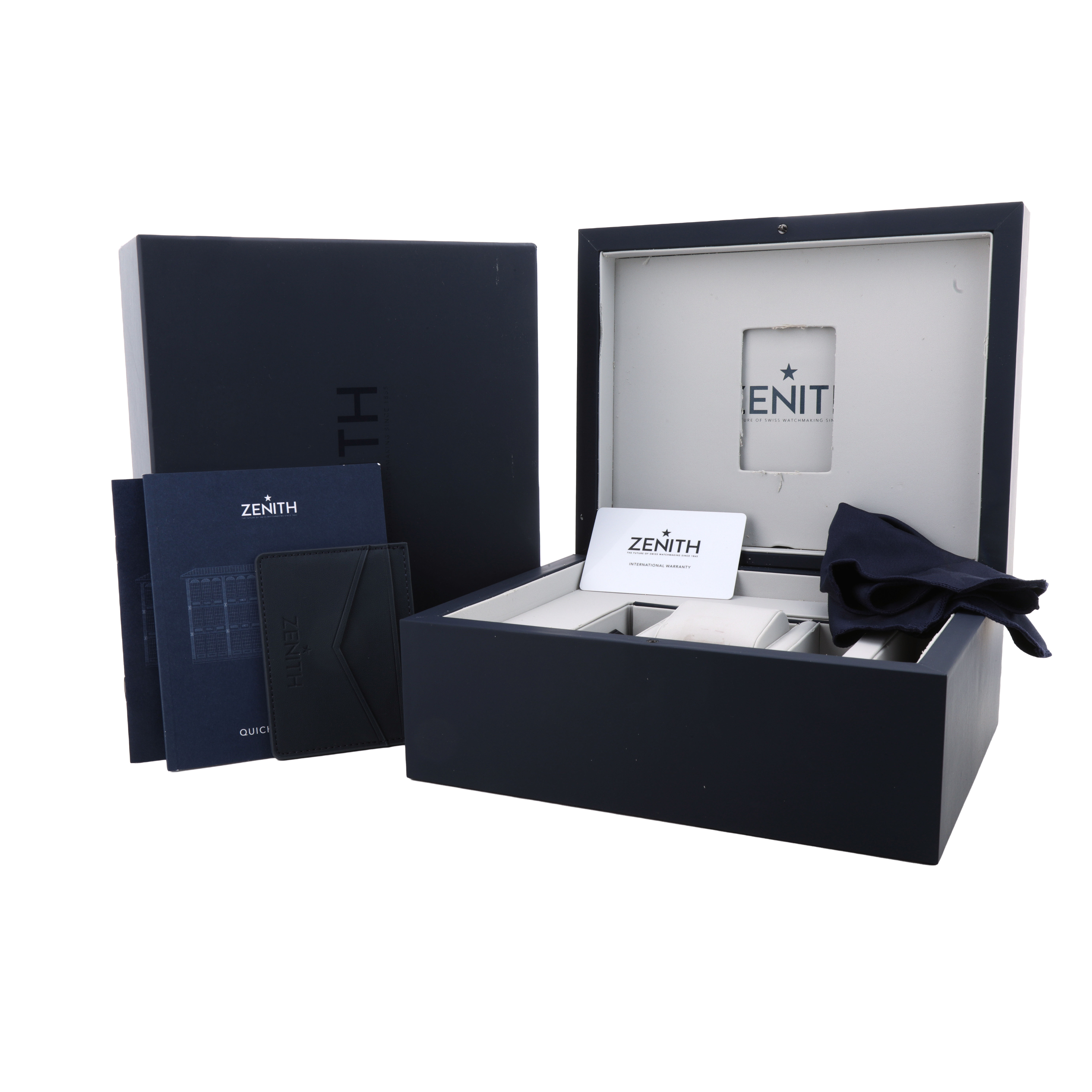 The image shows the packaging and accessories for a Zenith Pilot 05.2430.4069/17.I011 Men's Titanium Silver Dial watch, including a box, booklets, and cloth.