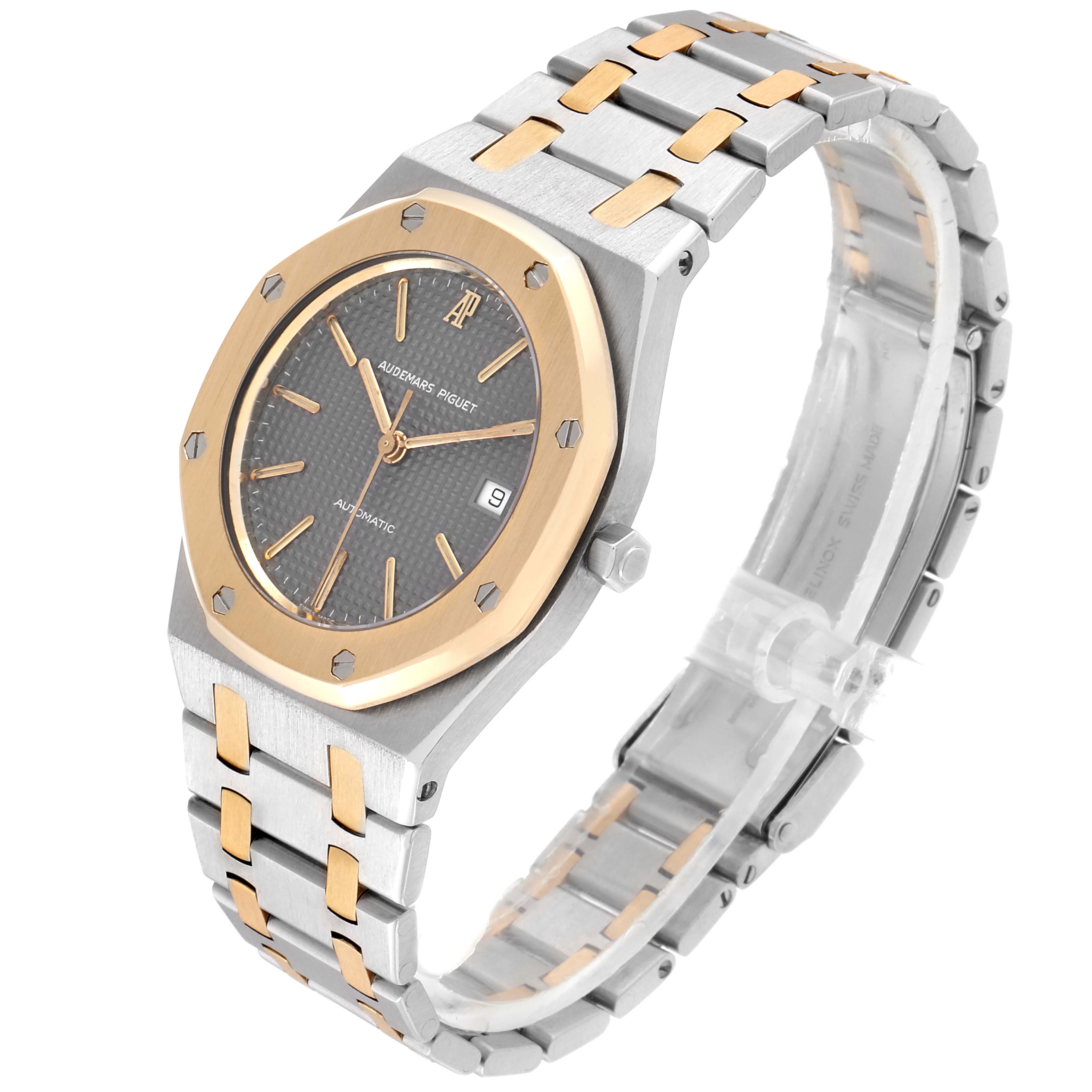 The Audemars Piguet Royal Oak SA14486 Men's Steel and Gold (two tone) Grey Dial SA14486 Men's Steel and Gold (two tone) Grey Dial watch is shown at a three-quarter angle displaying the dial, bezel, crown, and bracelet.