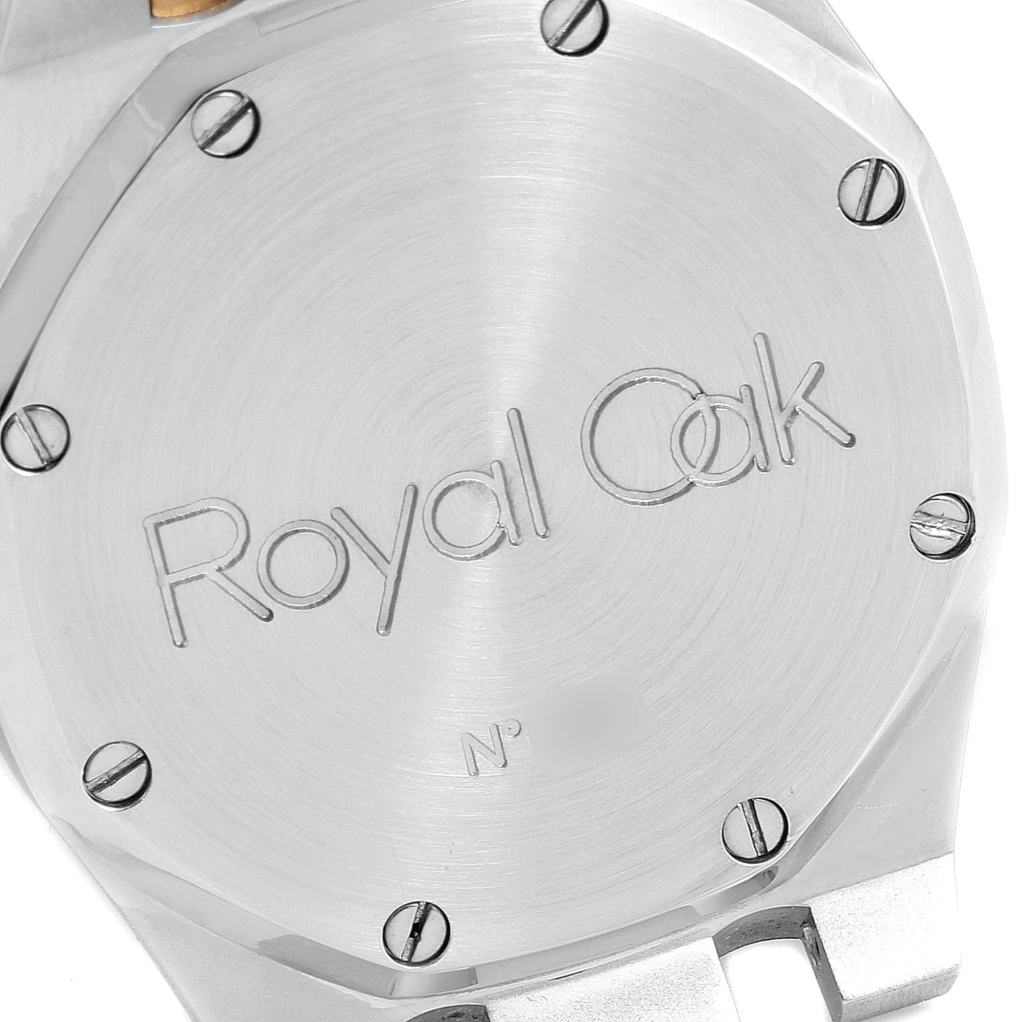 The image shows the case back of an Audemars Piguet Royal Oak SA14486 Men's Steel and Gold (two tone) Grey Dial SA14486 Men's Steel and Gold (two tone) Grey Dial watch, featuring its engraved logo and screws.