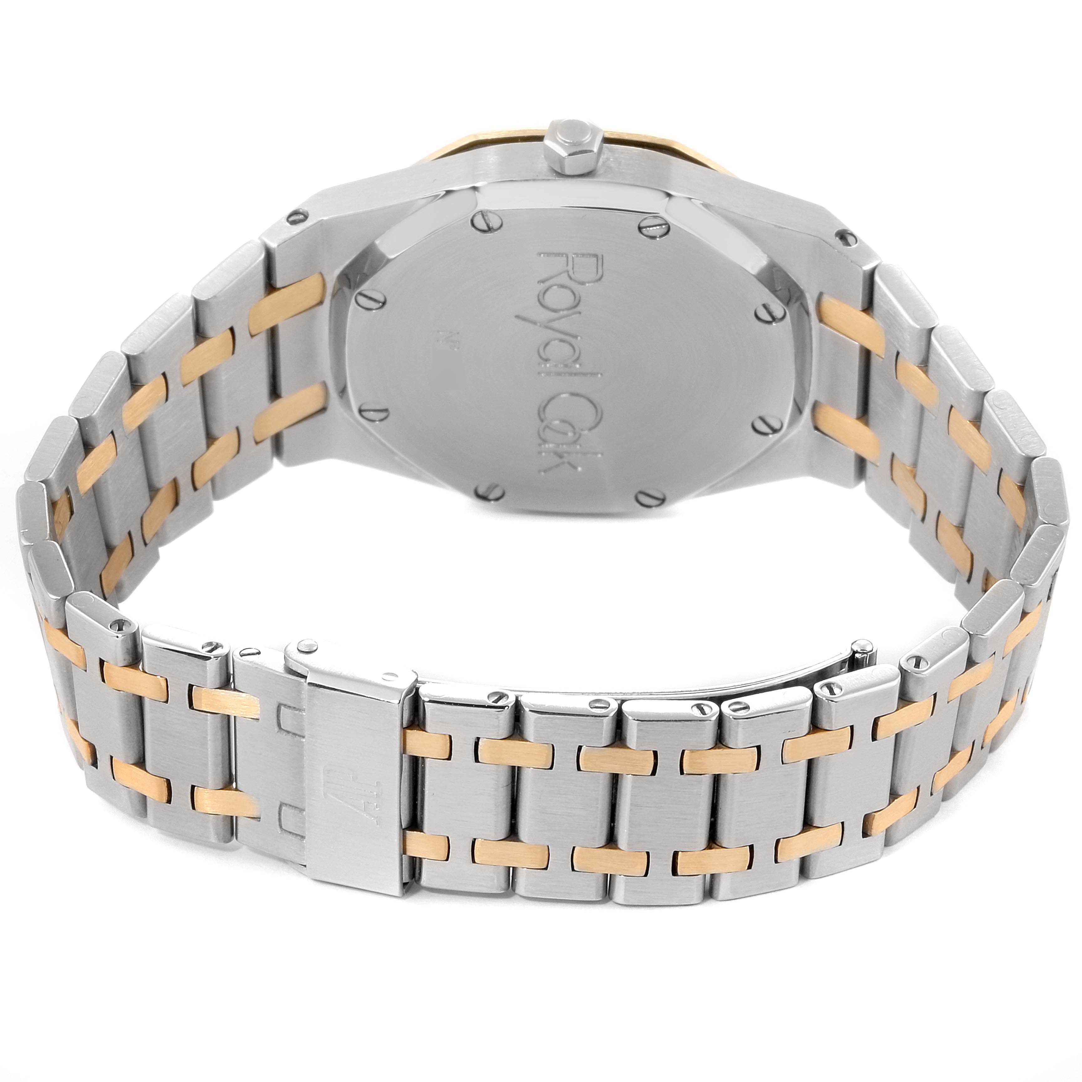 The image shows the back view of an Audemars Piguet Royal Oak SA14486 Men's Steel and Gold (two tone) Grey Dial SA14486 Men's Steel and Gold (two tone) Grey Dial watch, highlighting its clasp and bracelet.