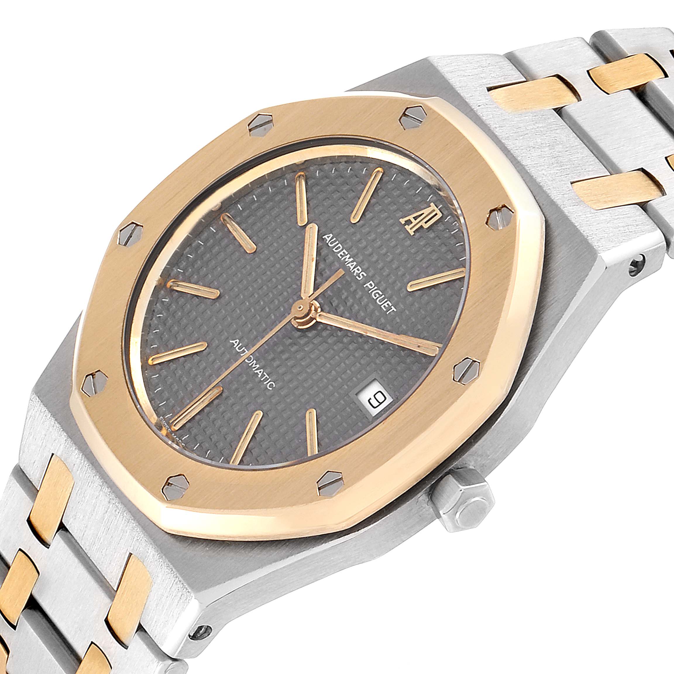 This image shows a close-up angled view of the Audemars Piguet Royal Oak SA14486 Men's Steel and Gold (two tone) Grey Dial SA14486 Men's Steel and Gold (two tone) Grey Dial watch, highlighting the bezel, dial, date window, and bracelet.