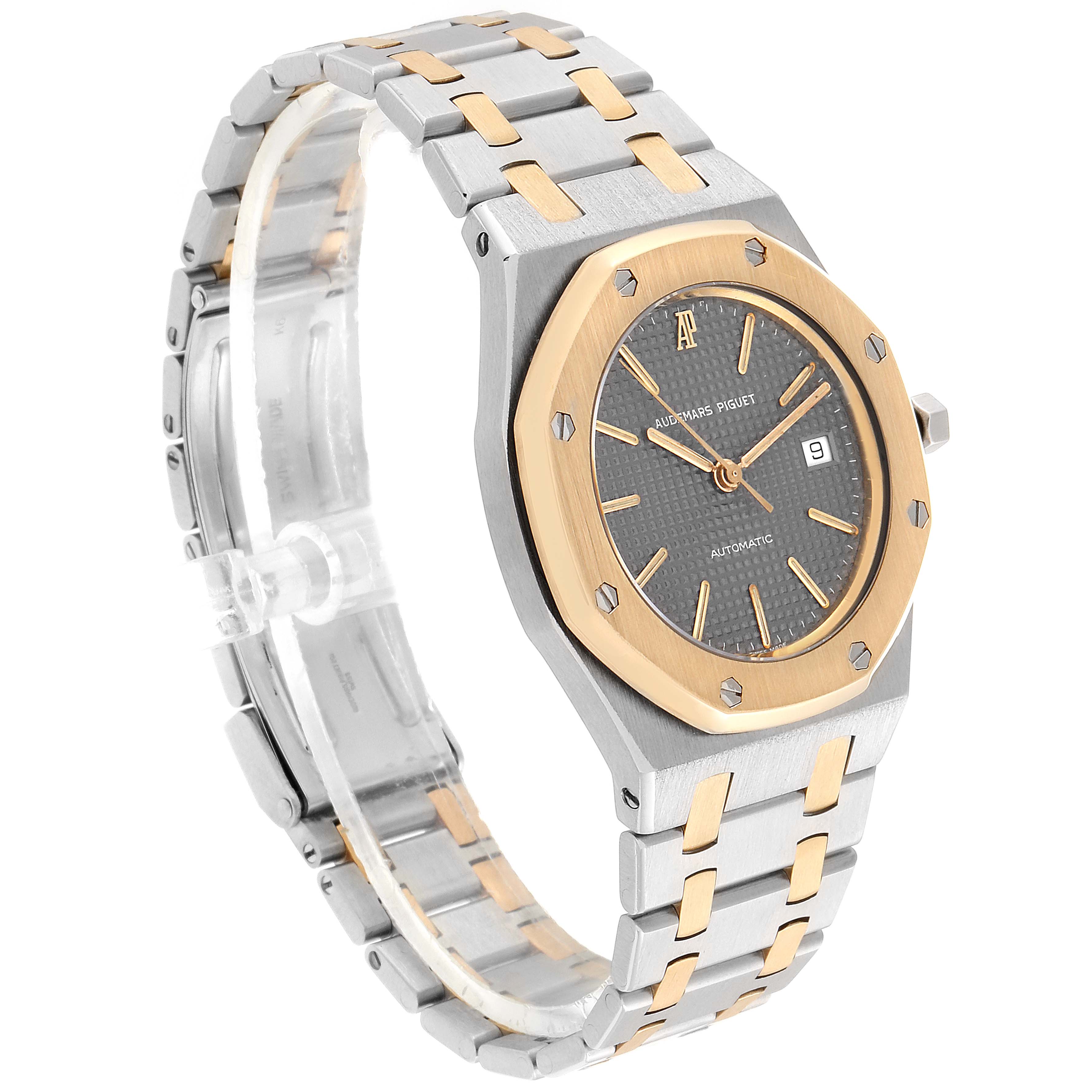 The image shows a side angle of a Royal Oak by Audemars Piguet, featuring its dial, bezel, and bracelet.