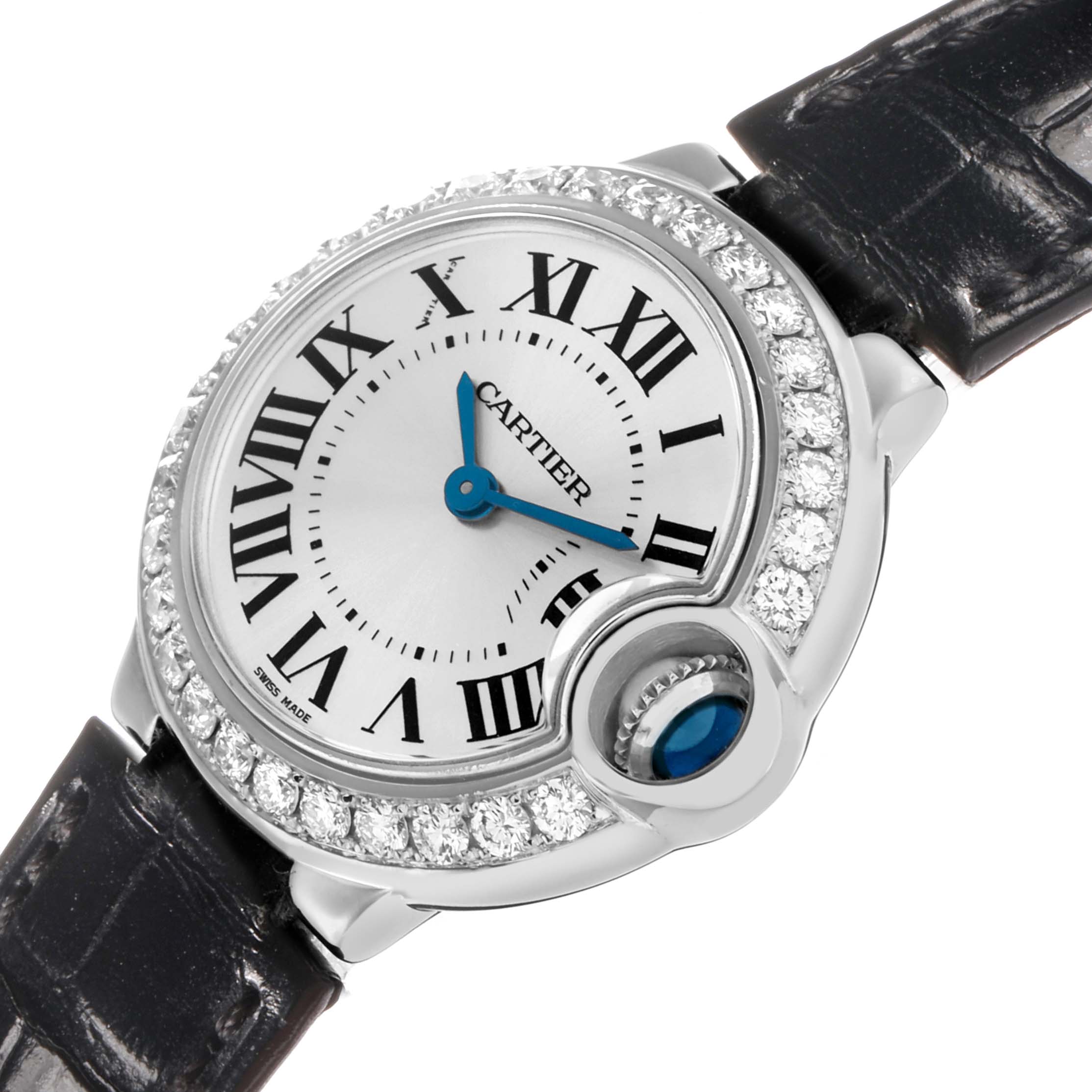 The Cartier Ballon Bleu WE900351 Women's White Gold Silver Dial watch is shown at a slight angle, highlighting its diamond bezel, unique crown, and blue hands.