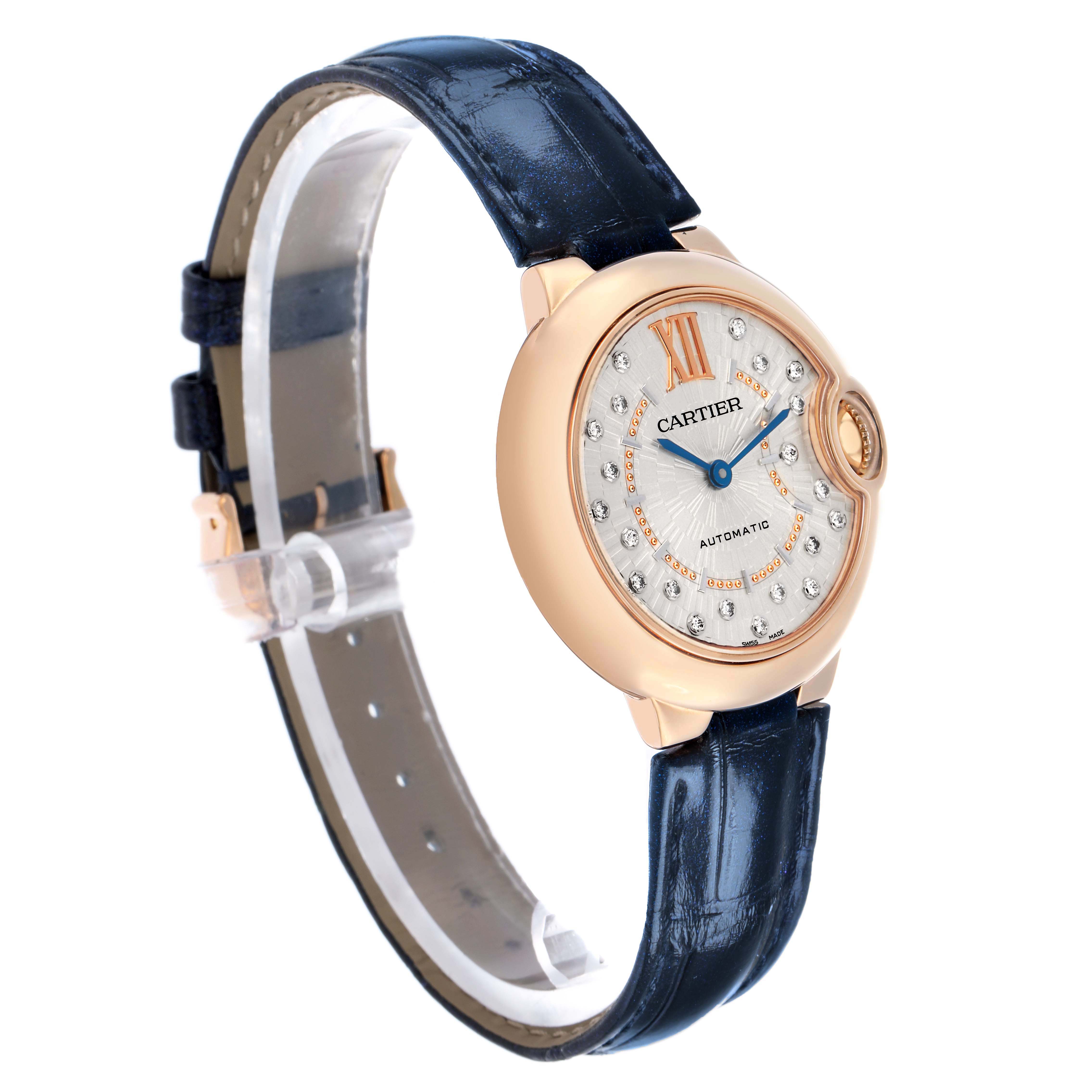 The image shows a Cartier Ballon Bleu WGBB0052 Women's Rose Gold Silver Dial watch at a slight angle, highlighting the face, case, blue strap, and gold detailing.