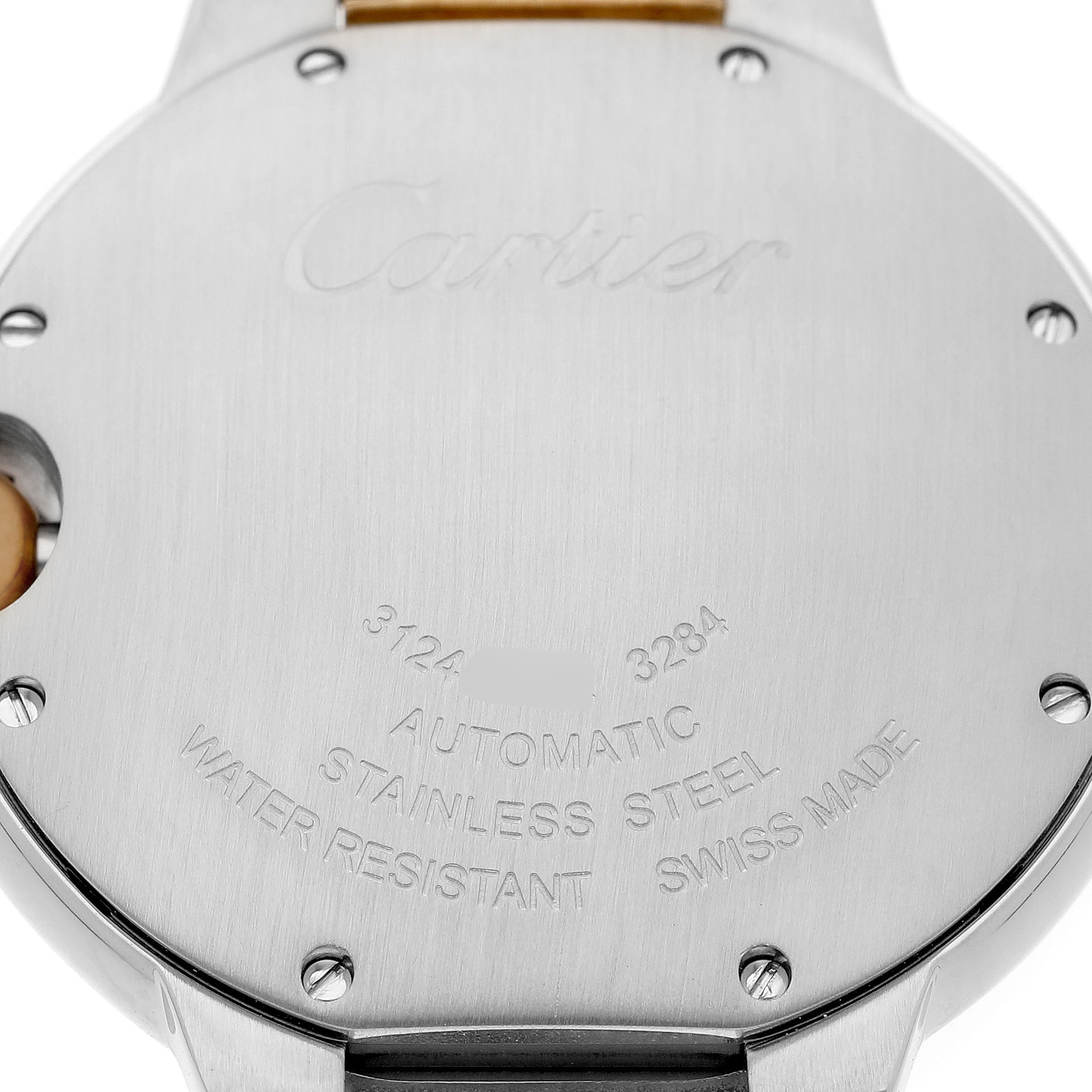 The image shows the back case of a Cartier Ballon Bleu W6920047 Women's Stainless Steel Silver Dial watch, featuring engraved specifications and screws.