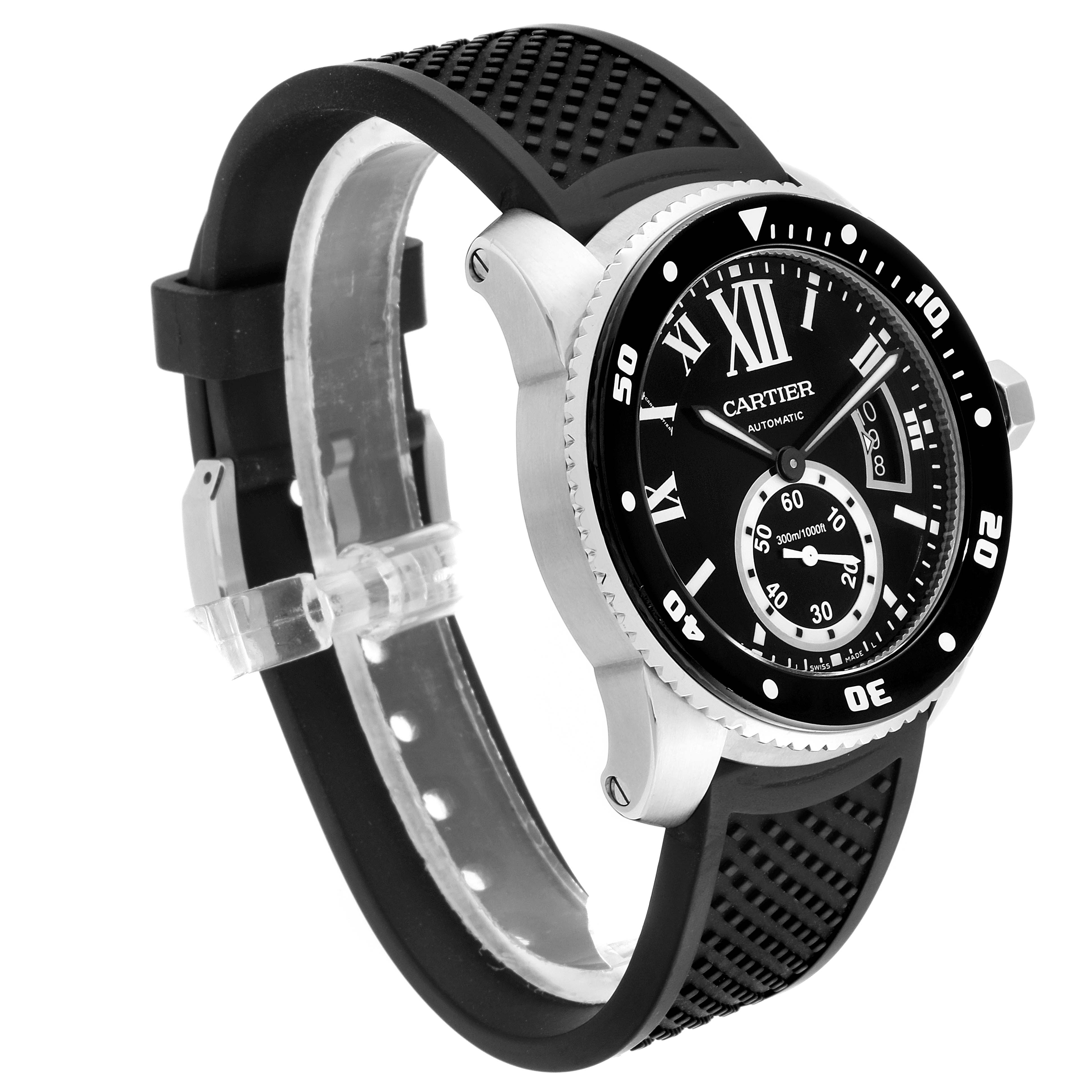 The Calibre de Cartier watch by Cartier is shown at a three-quarter angle, featuring its black dial, bezel, and rubber strap.
