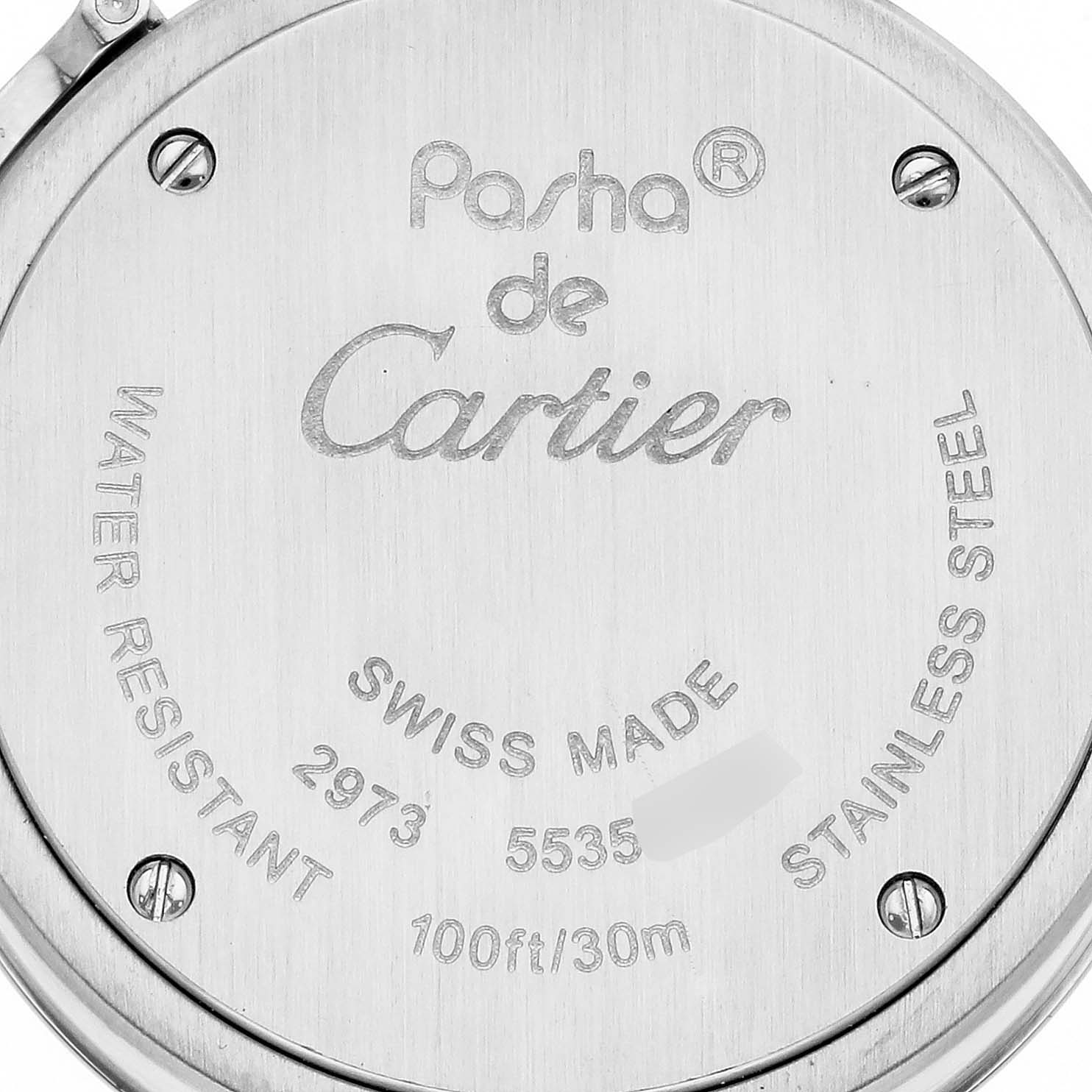 The image shows the back case of a Cartier Pasha W3140024 Women's Stainless Steel Blue Dial W3140024 Women's Stainless Steel Blue Dial watch with engravings.