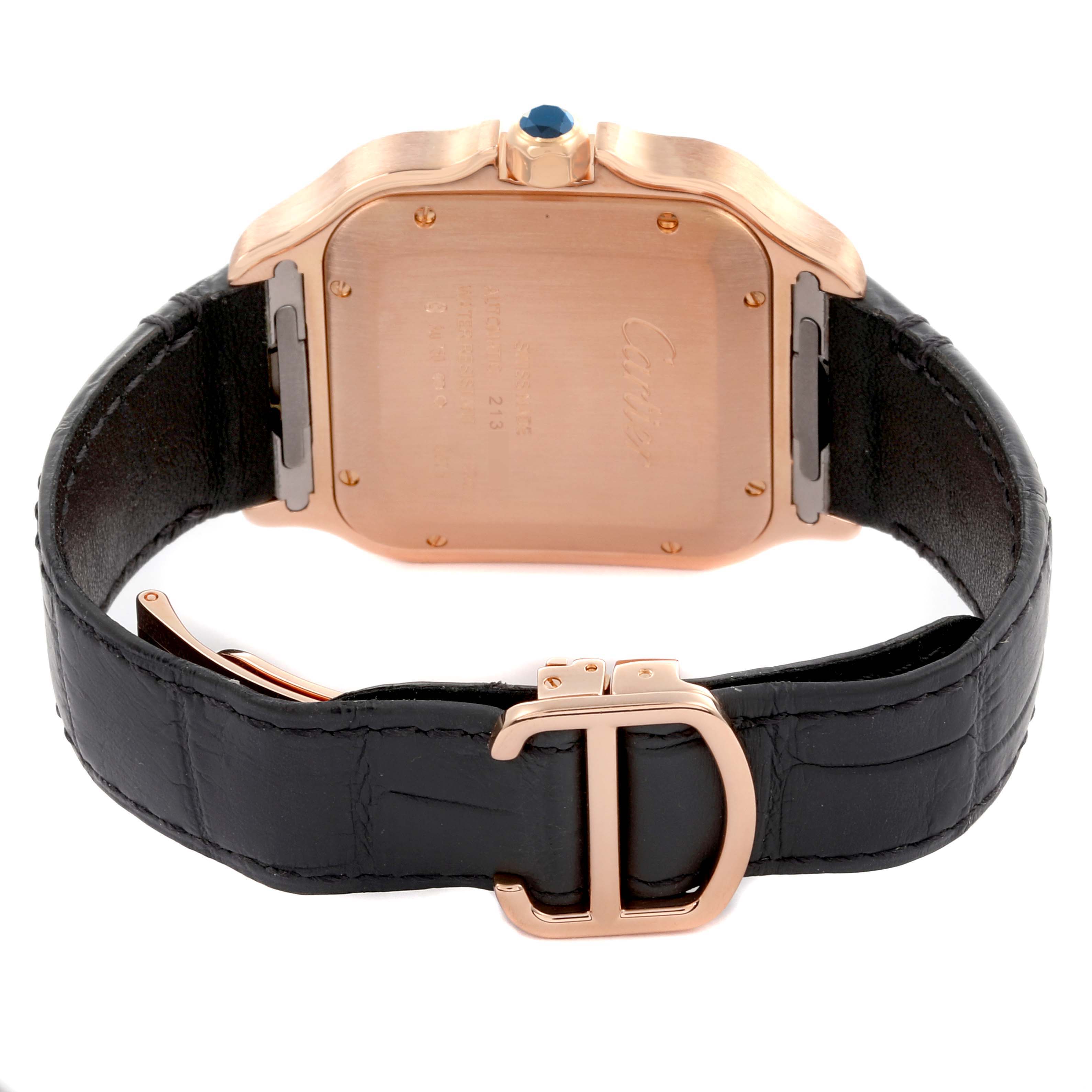 The image shows the back of the Cartier Santos WGSA0011 Men's Rose Gold Silver Dial WGSA0011 Men's Rose Gold Silver Dial watch, including its case, crown, and leather strap with a clasp.