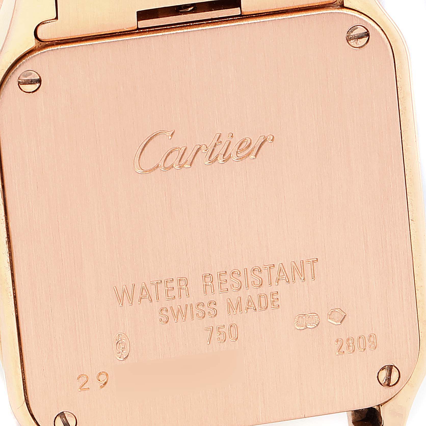 The image shows the back case of the Cartier Santos Demoiselle WF9007Z8 Women's Rose Gold Silver Dial WF9007Z8 Women's Rose Gold Silver Dial watch, displaying brand engraving and water resistance details.