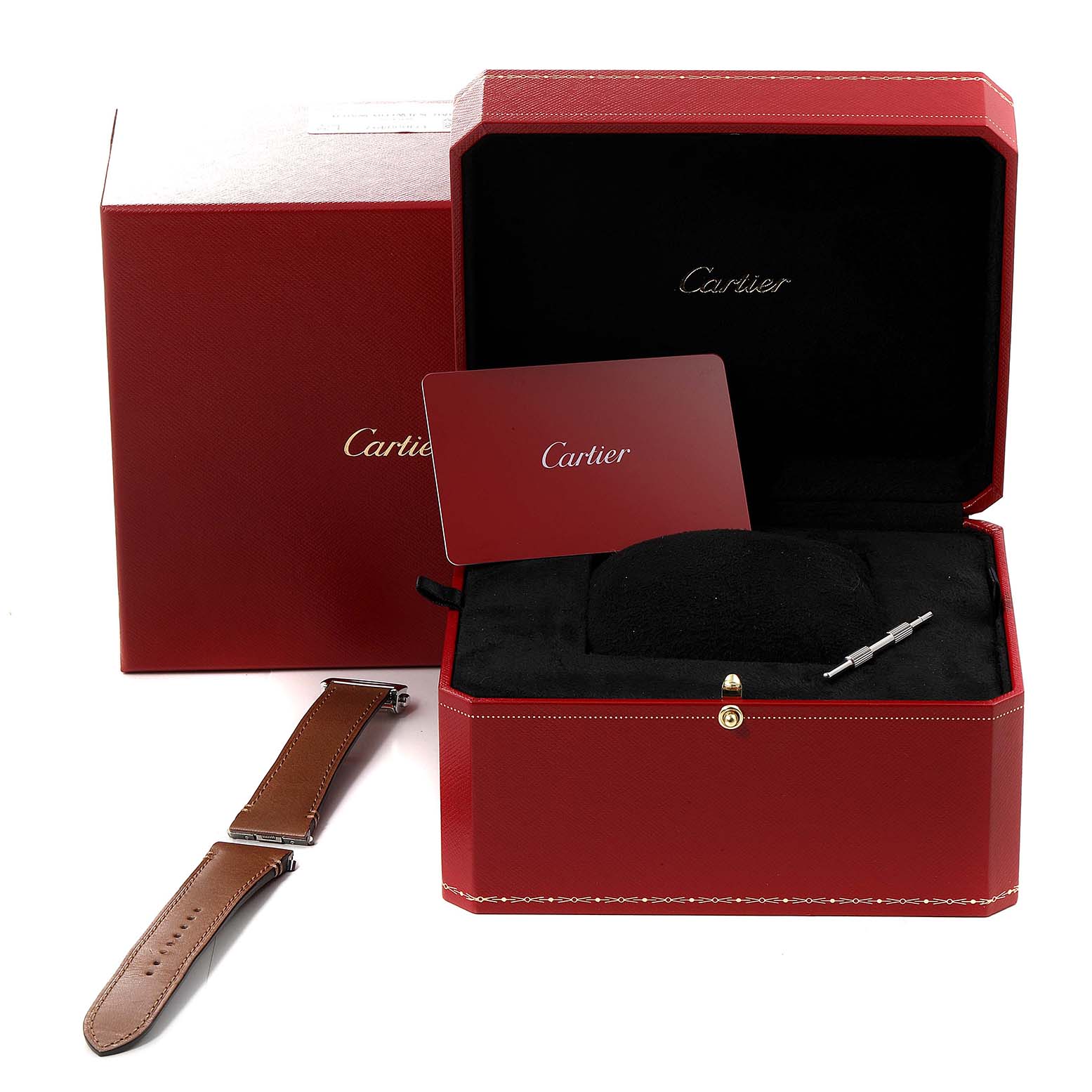 The image shows a Cartier Santos WSSA0030 Men's Stainless Steel Blue Dial WSSA0030 Men's Stainless Steel Blue Dial watch box with a manual, a leather strap accessory, and a tool at a frontal angle.