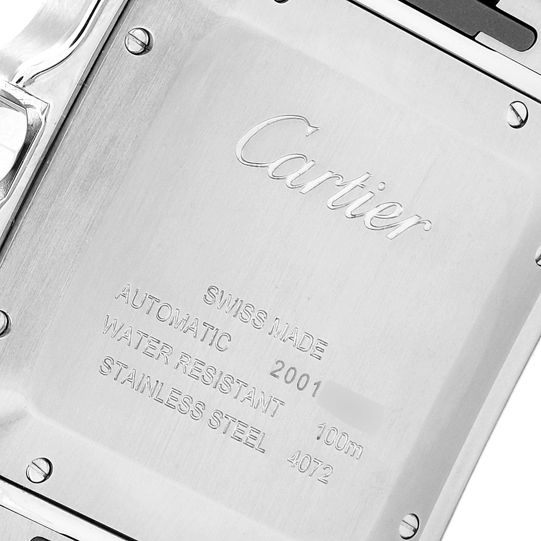 The image shows the back case of a Santos model watch by Cartier, featuring brand engraving and specification details.